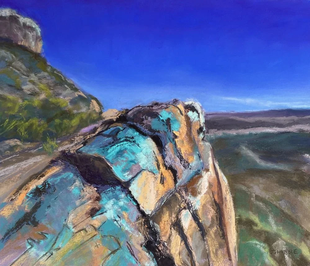 Colorful painting of a rocky shoreline with a cliff on the left, blue sky, and waves near the rocks.