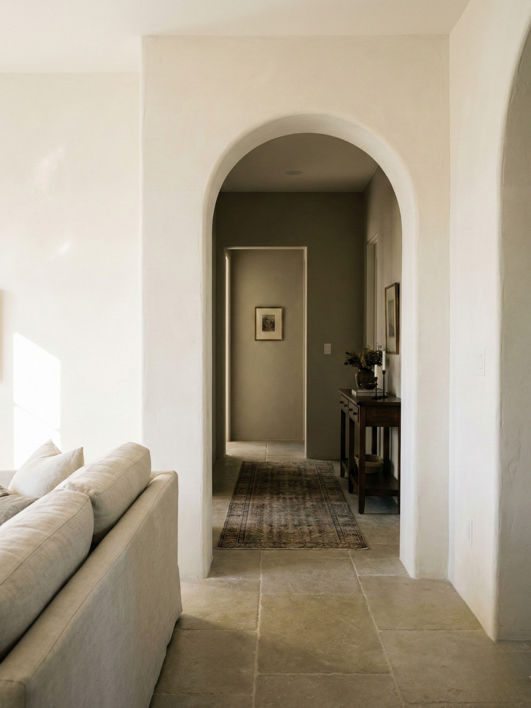 Color flow: transitioning from a light living room to a darker painted room