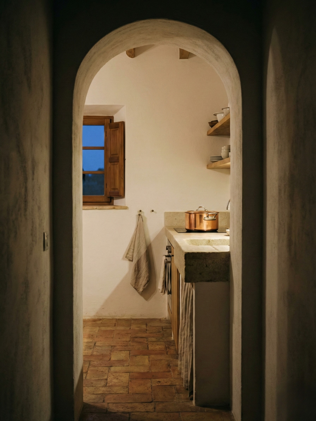 view from hallway into mediterranean kitchen