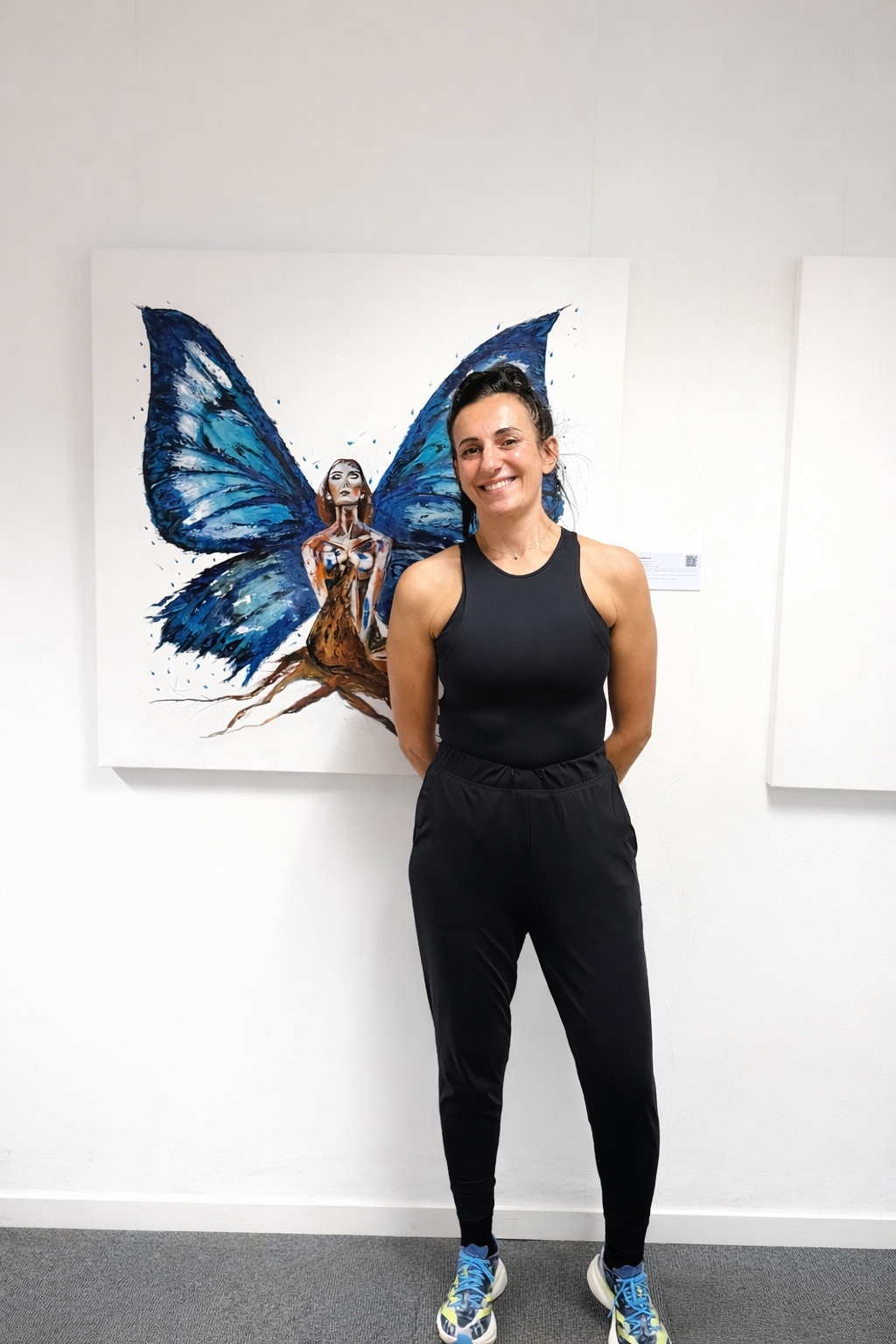Karina Yacoubian with her painting Metamorphosis, Pure White Reinvention series