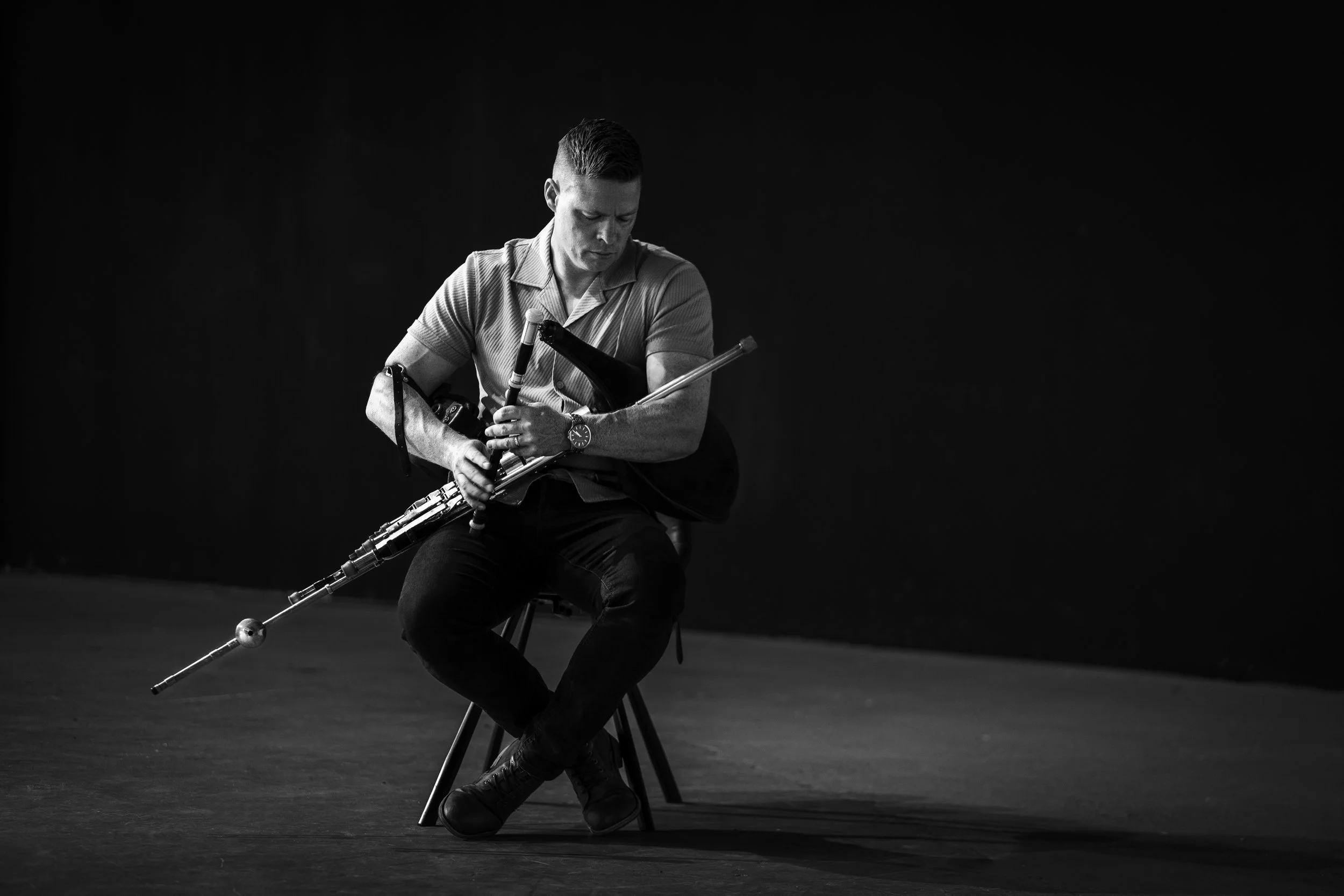 Seán McKeon performing uilleann pipes at a traditional Irish music event