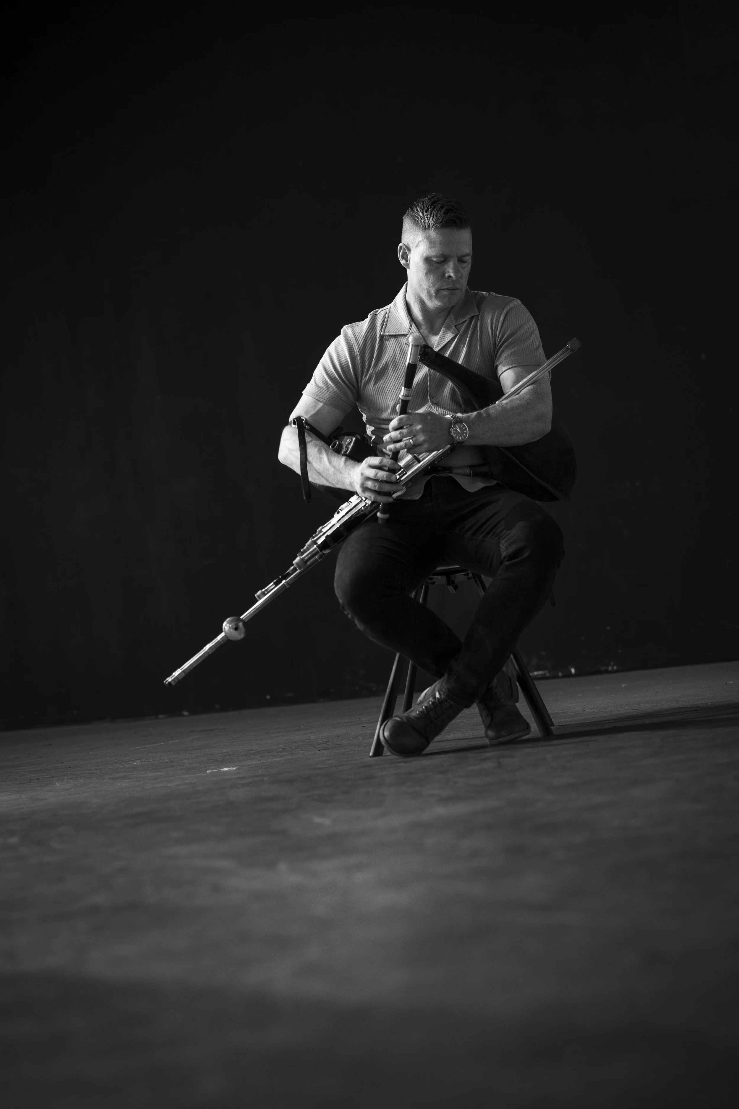 Seán McKeon performing uilleann pipes at a traditional Irish music event
