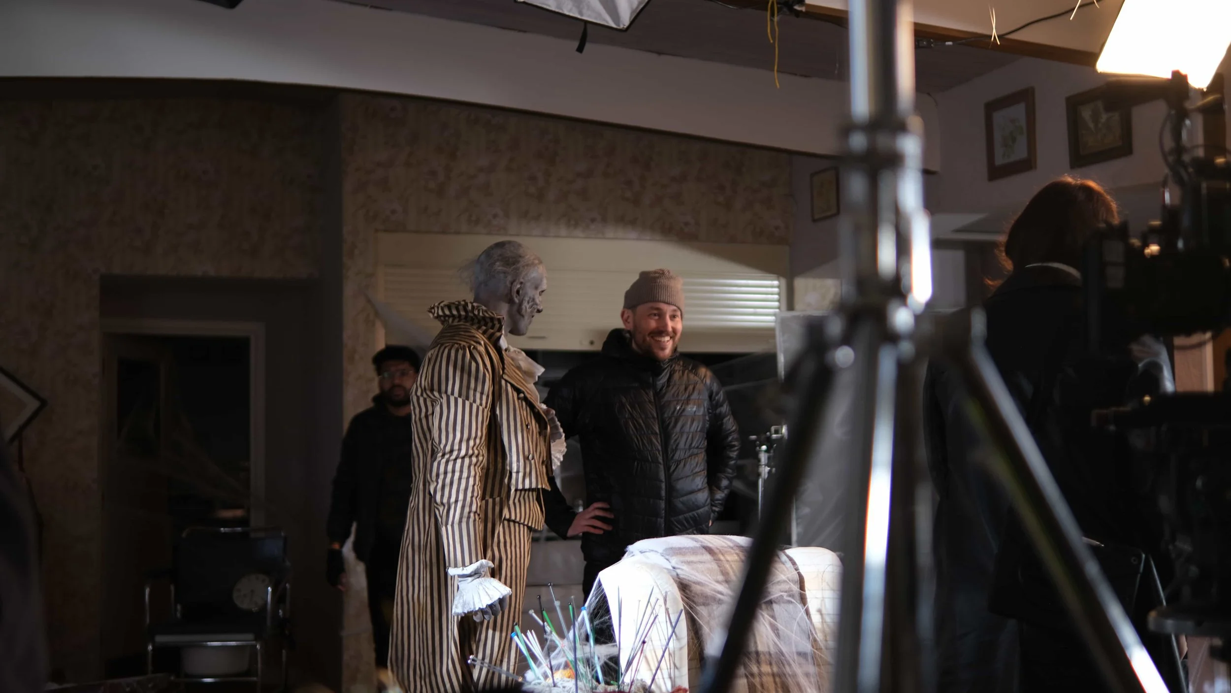 Behind the scenes of The Humbug. Director Cole Paviour speaks with The Humbug actor Malik Ibheis on set, with professional lighting and camera equipment.