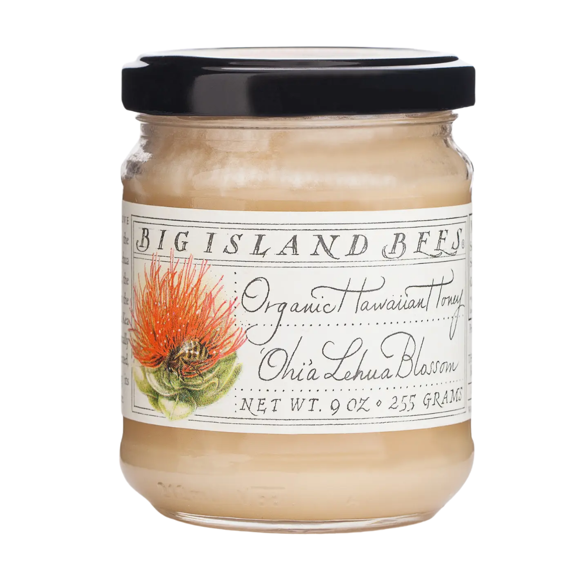 A glass jar with a black lid containing a creamy substance, labeled "Big Island Bees Organic Hawaiian Tony Ohi Lehua Blossom." The label features an illustration of a red-orange flower with a bee on it, and notes a net weight of 9 ounces or 255 grams.