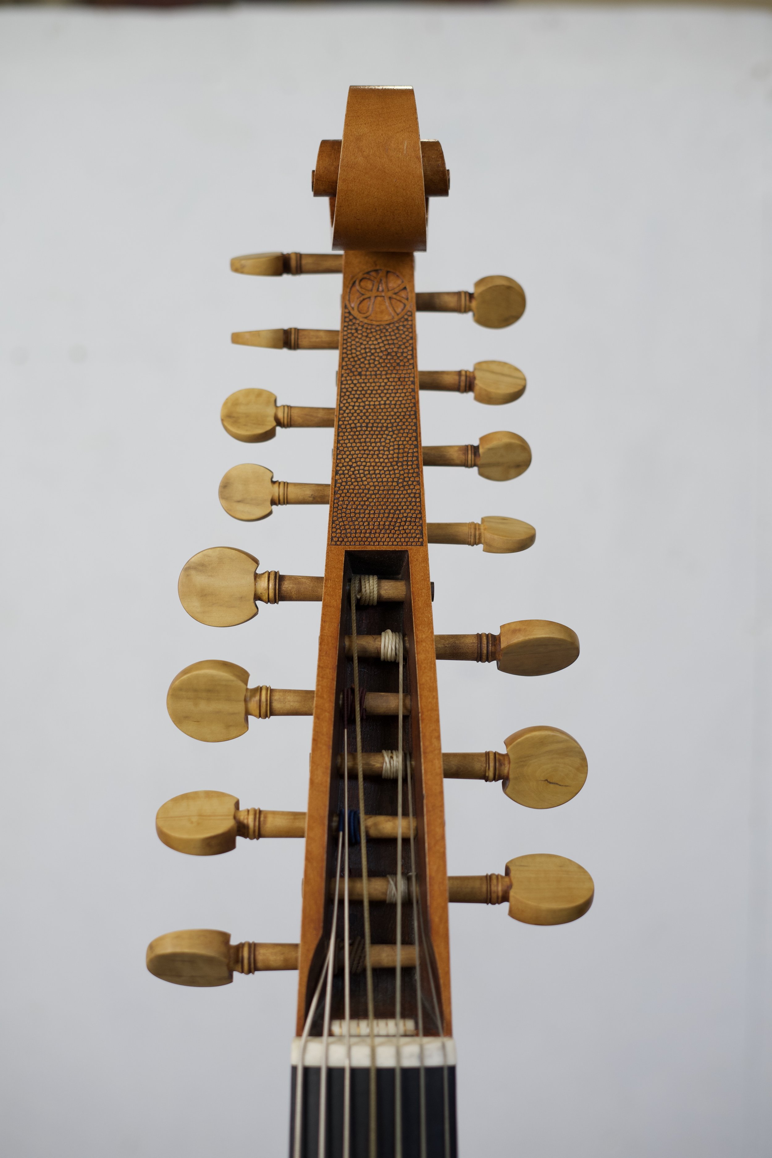 Front view of pegbox showing all 15 boxwood pegs