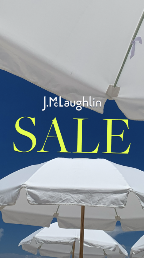 A promotional image for a J. McLaughlin sale, featuring white umbrellas against a bright blue sky.