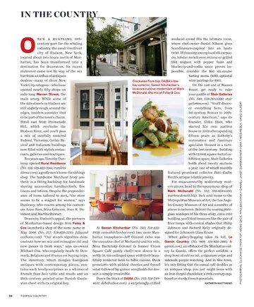Open book featuring an article about healthy burgers, chef preparing a burger, and a kitchen scene with countertops and shelves.