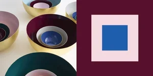 A collection of bowls with colorful interiors and a geometric abstract artwork with a blue square on a pink background