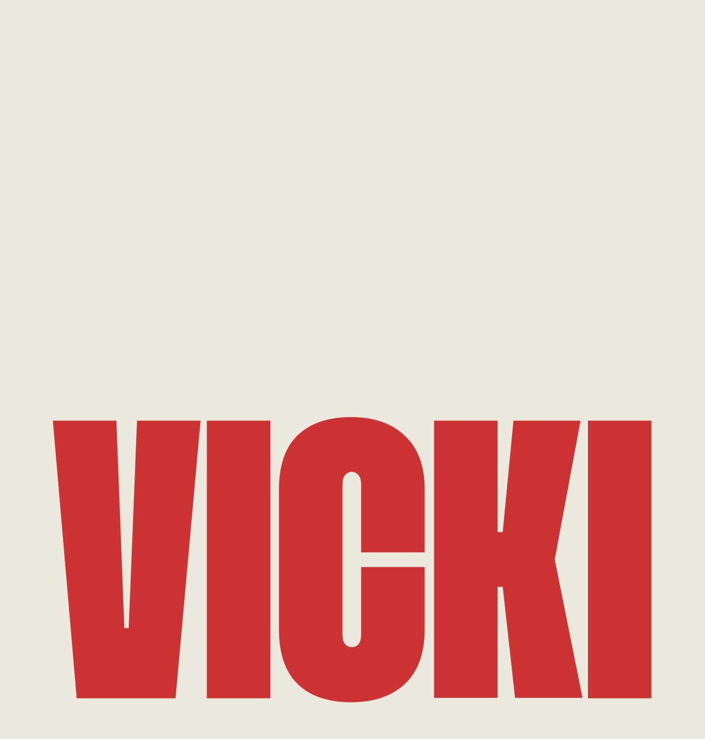 Text reading VICKI in bold red letters on a light beige background.