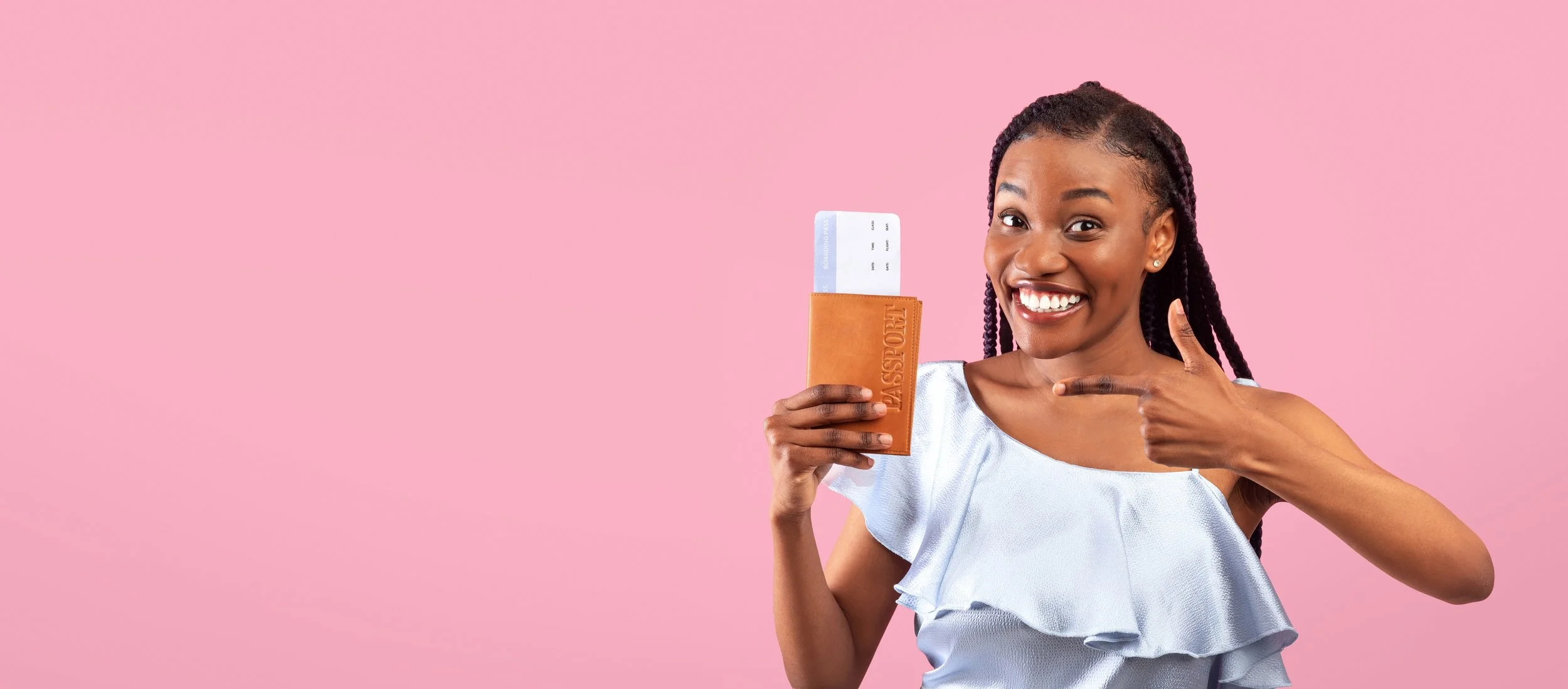 Passport Black girl holding up hers.jpg