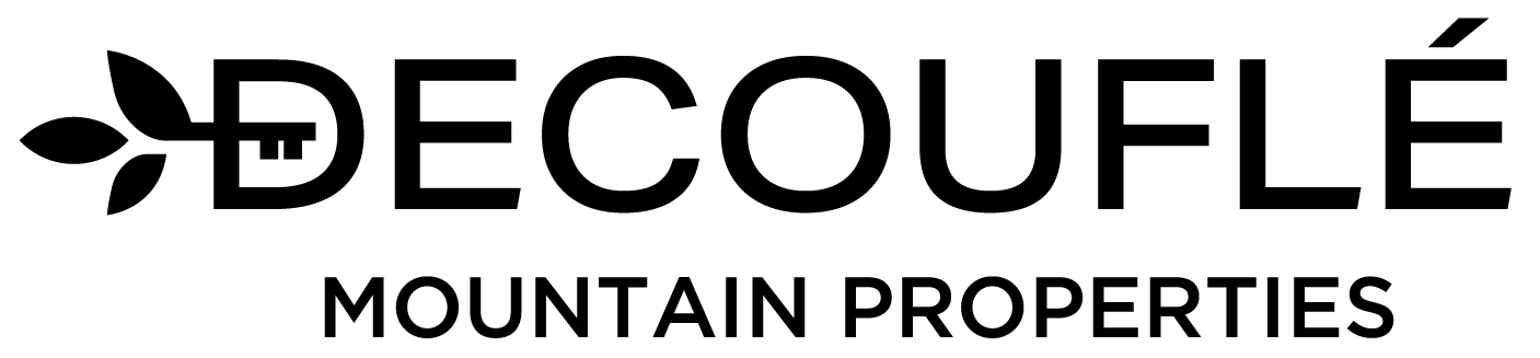 Close-up of a white computer keyboard with the letters and symbols in focus.