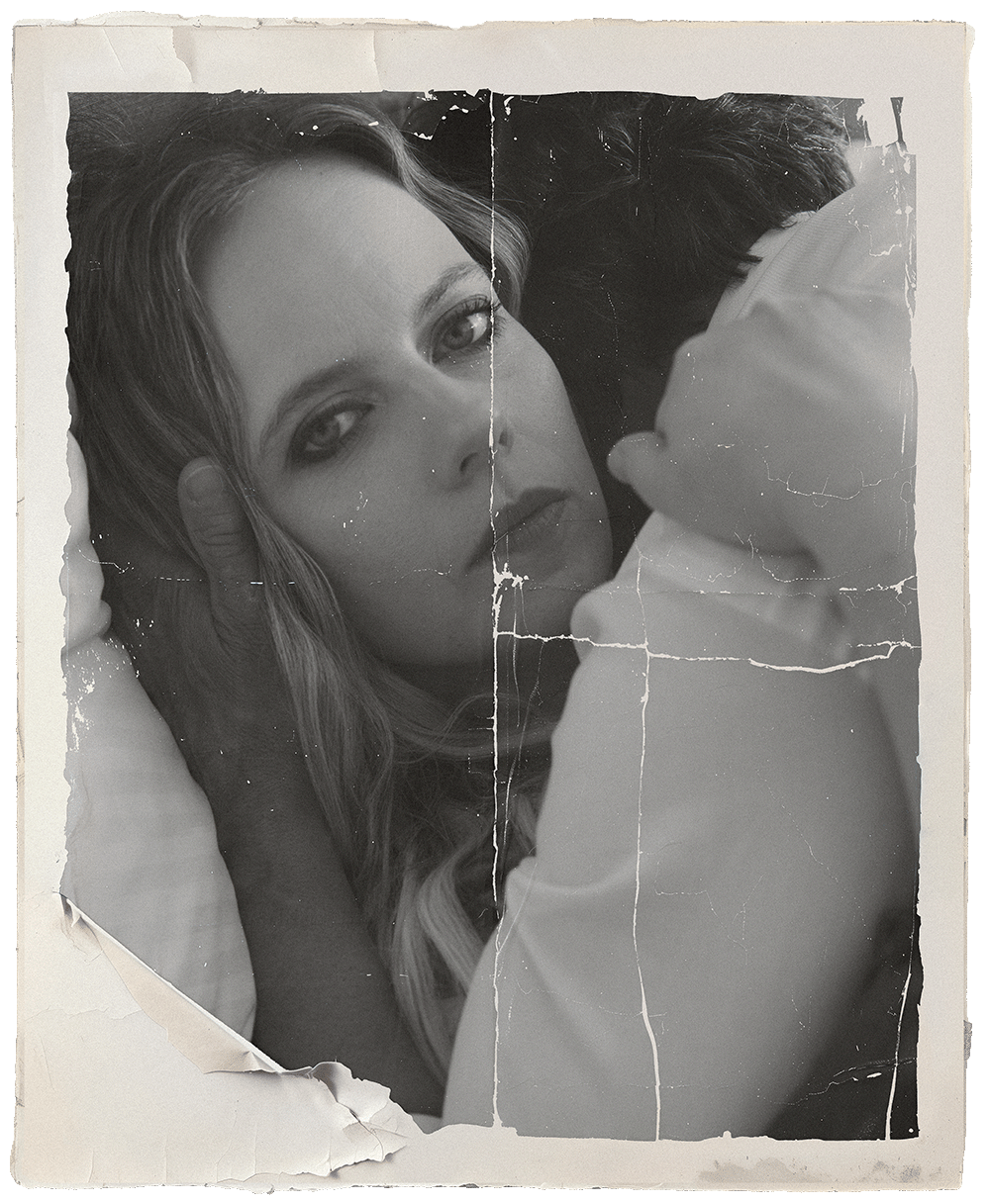 Black-and-white portrait of Pippa Scott lying down with a man leaning over her, framed with a distressed vintage photo effect.