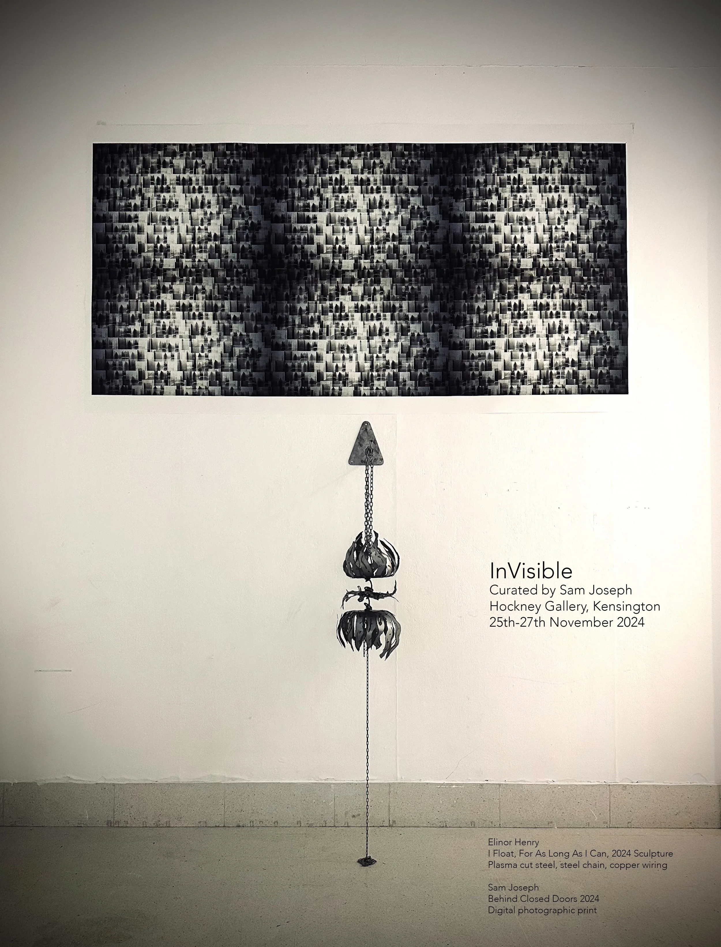Art exhibit poster titled "InVisible" curated by Sam Joseph at Hockney Gallery, Kensington, from November 25 to 27, 2024. The artwork by Elinor Henry titled "I Float, For As Long As I Can, 2024" features a sculpture with plasma cut steel, steel chain, and copper wiring, hanging vertically. The poster includes a black and white patterned artwork with a chain hanging beneath it.