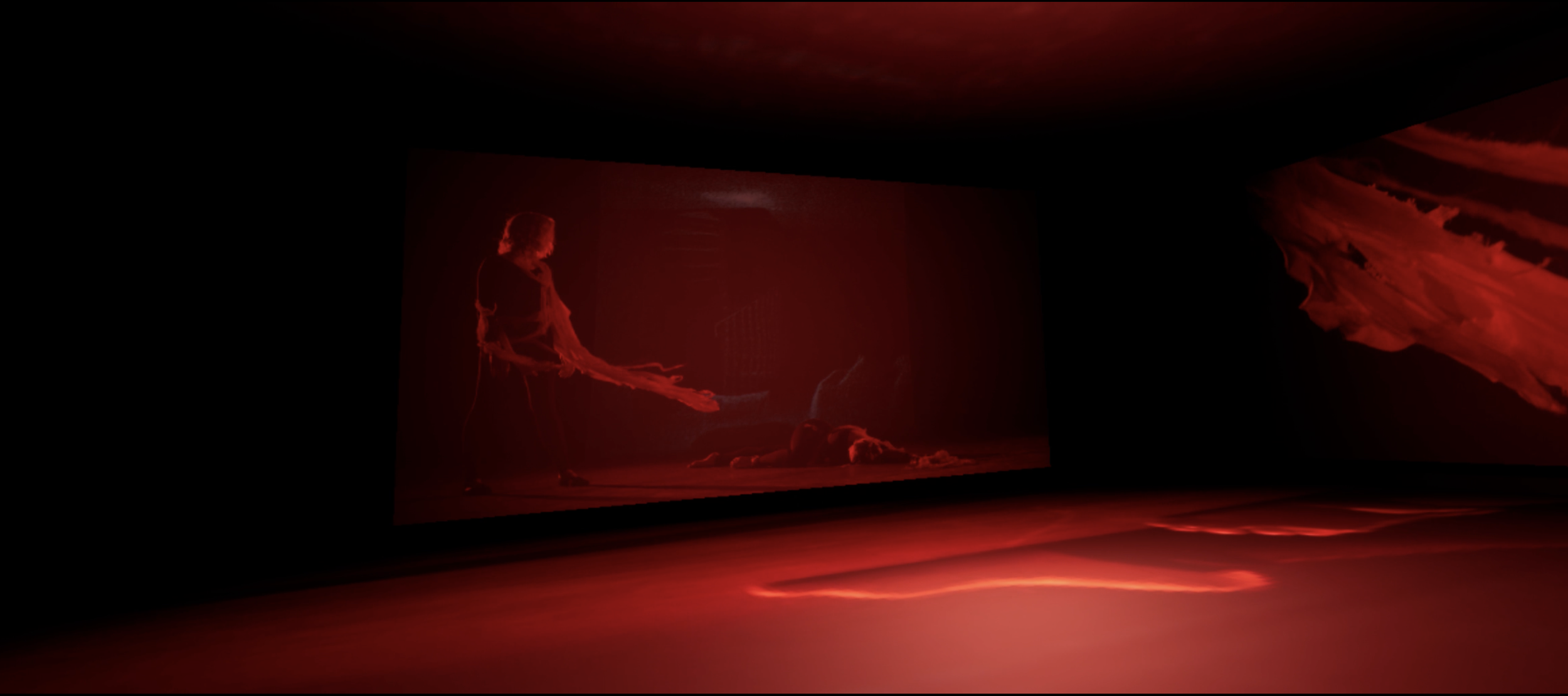A dark room with a digital or virtual art installation illuminated in red, featuring a figure on a screen with flowing clothing and abstract swirling shapes.