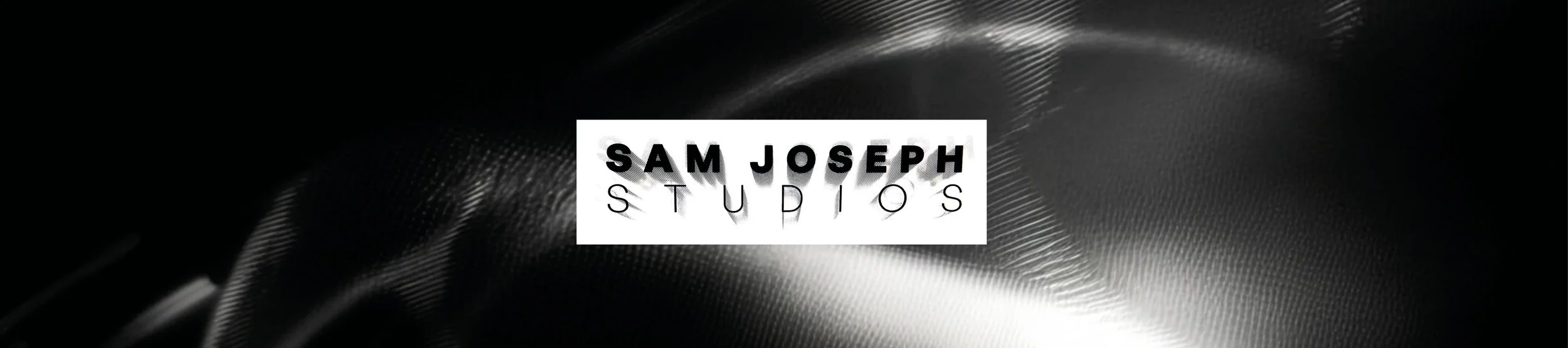 Logo for Sam Joseph Studios with bold black and thin black text on a white background, overlayed on a dark, abstract textured backdrop.
