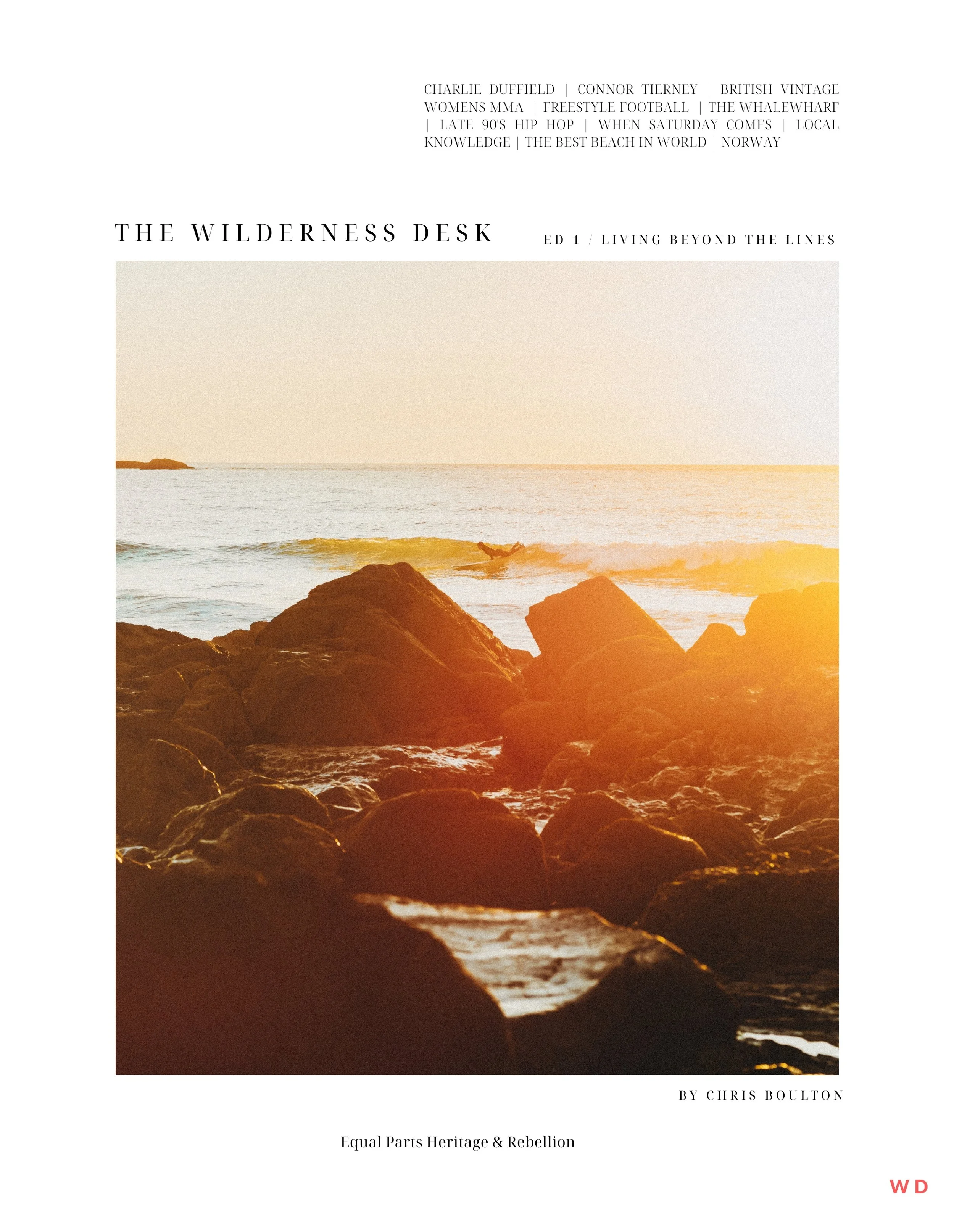 A book cover titled "The Wilderness Desk" featuring a sunset over rocks and the ocean with a person surfing in the water, with additional text about various topics and authors, including Charlie Duffield, Connor Tierney, and Chris Boulton.