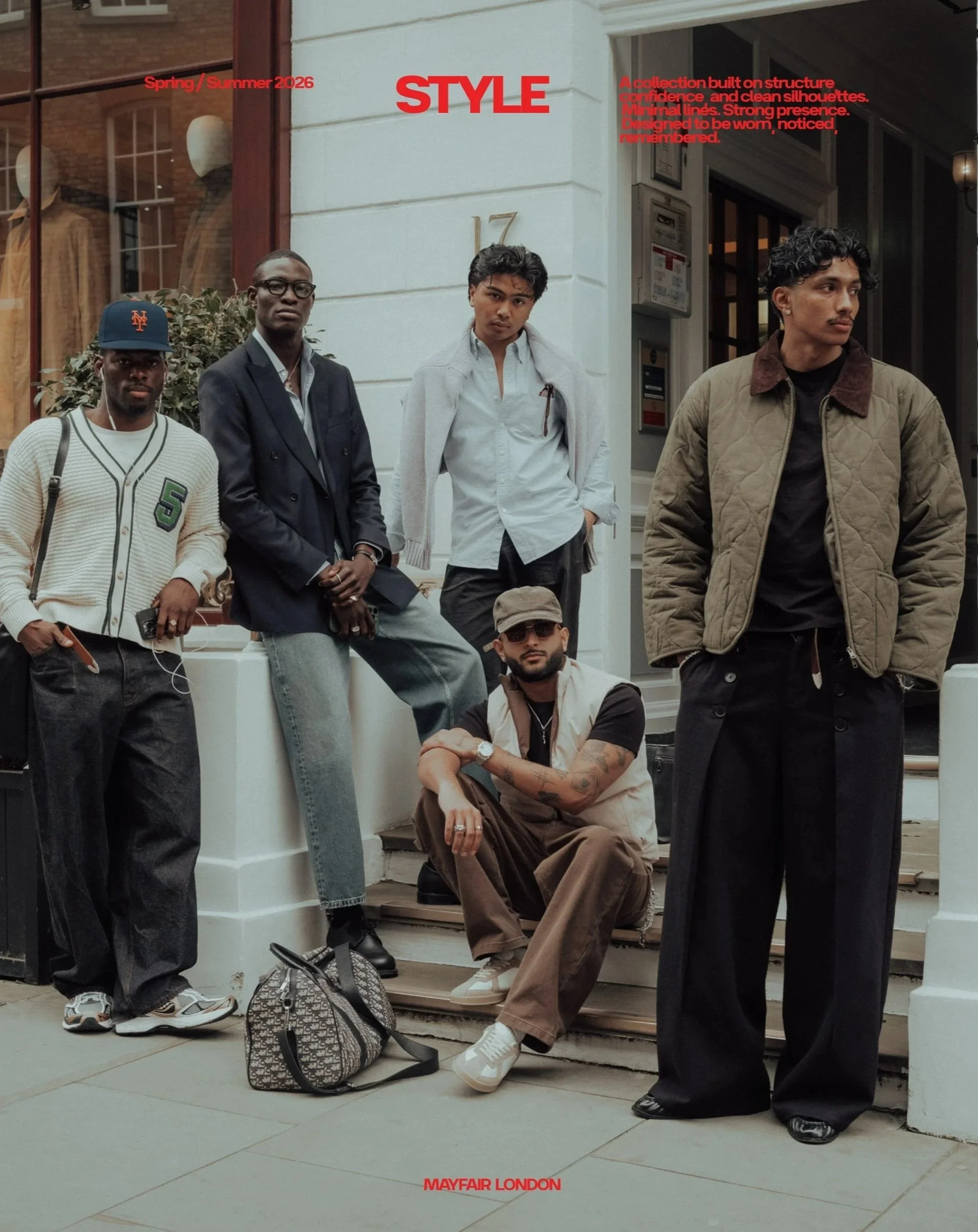 Five young men with diverse ethnicities gather outside a building, dressed in casual and stylish clothing, with backpacks nearby. The scene is urban, and the photo is part of a fashion editorial titled 'STYLE' for Mayfair London, Spring/Summer 2026.