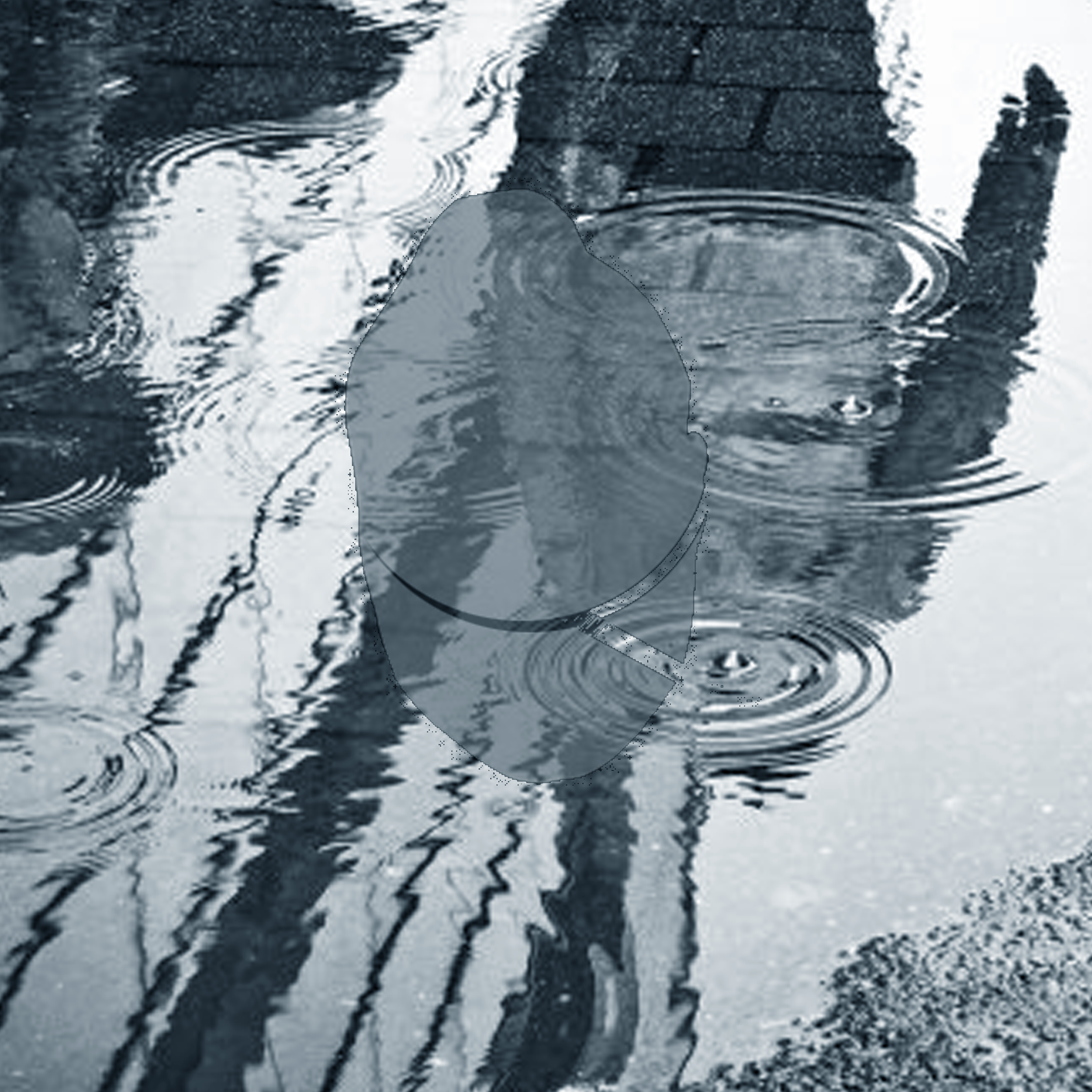 Black and white photo of a person holding an umbrella and walking through puddles, with their reflection visible in the water.