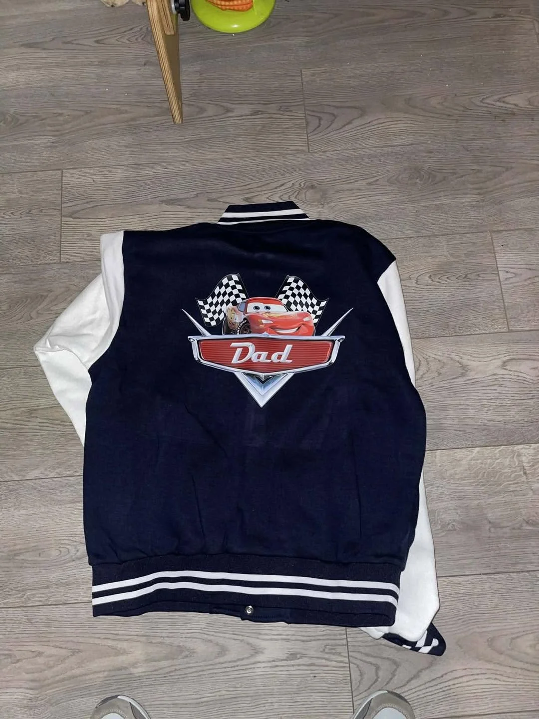 a jacket with a custom designed cars logo and name