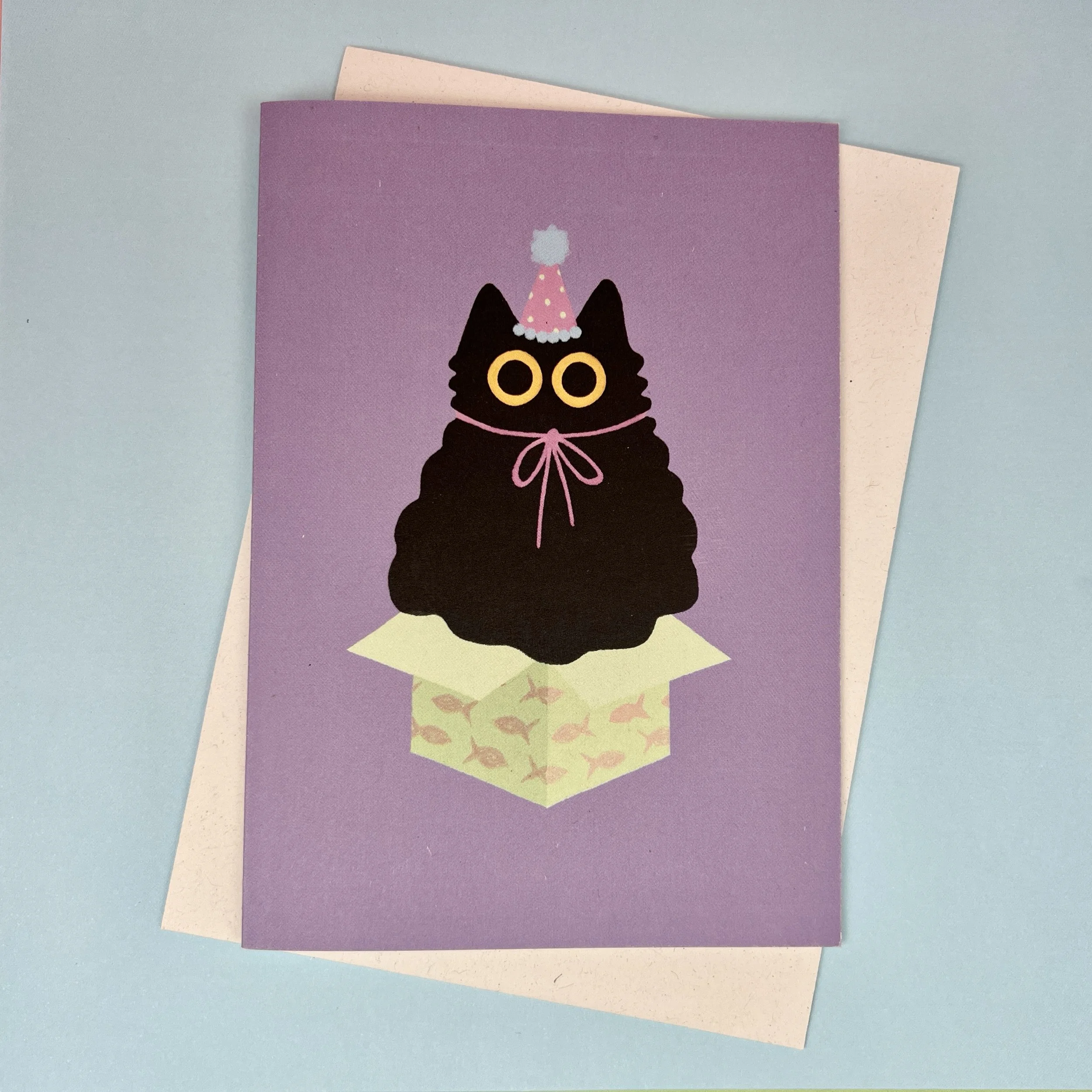 Black cat in party hat card