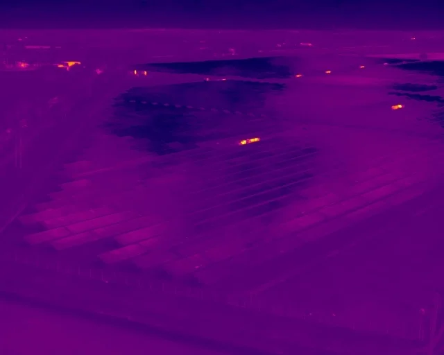 Thermal Night Surveillance Drone thermal imaging night surveillance detecting heat signatures across open field