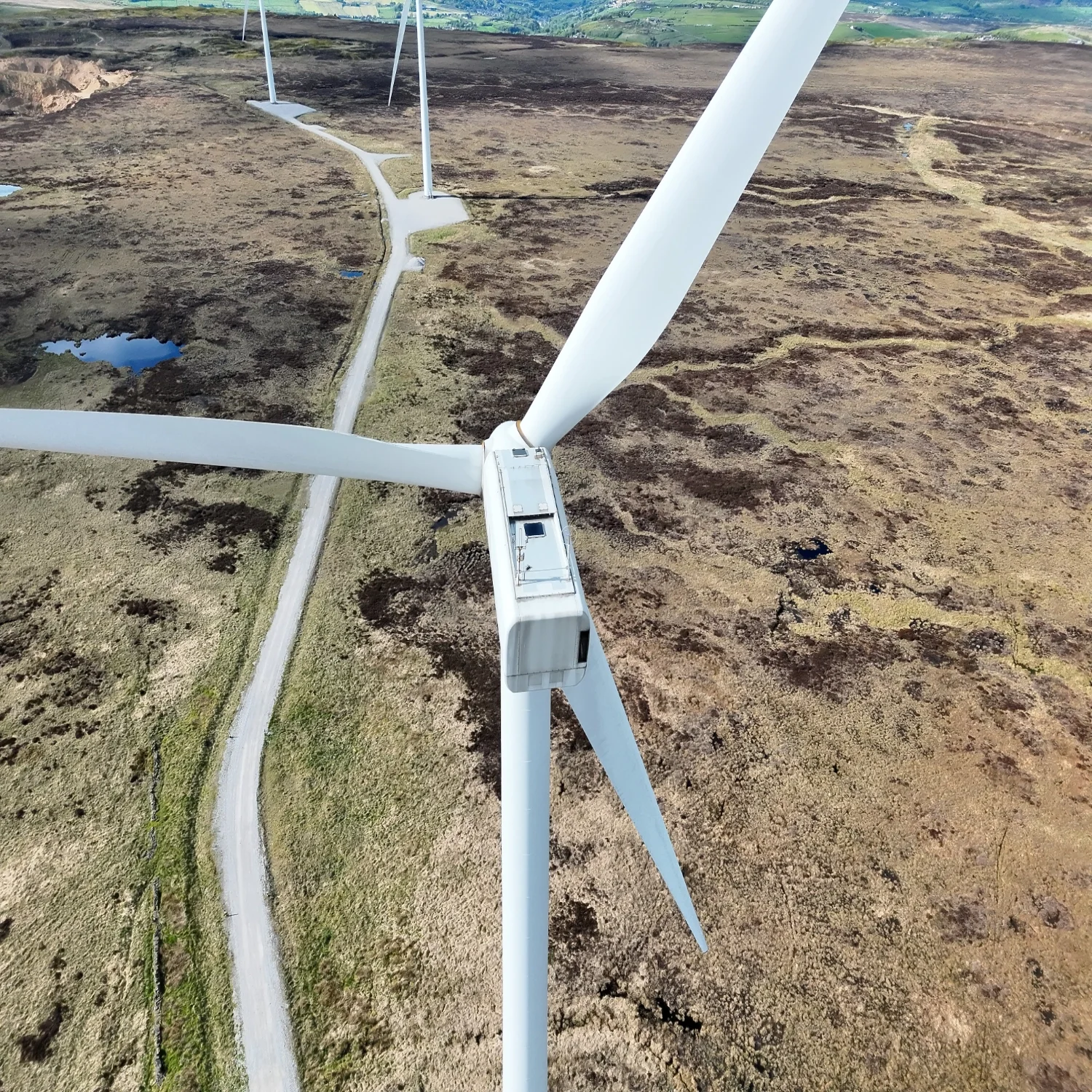 Professional drone survey of a UK wind farm, providing high-resolution aerial overview for site planning and asset management.