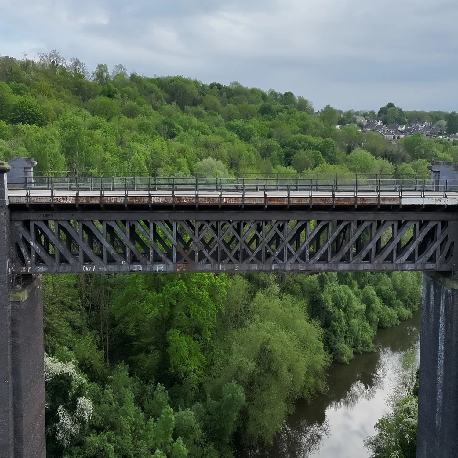 A comprehensive wide-angle view of a railway viaduct over the River, Yorkshire. We use IP55 weather-resistant drones to perform full-scale structural surveys, ensuring operational safety even in challenging environmental conditions