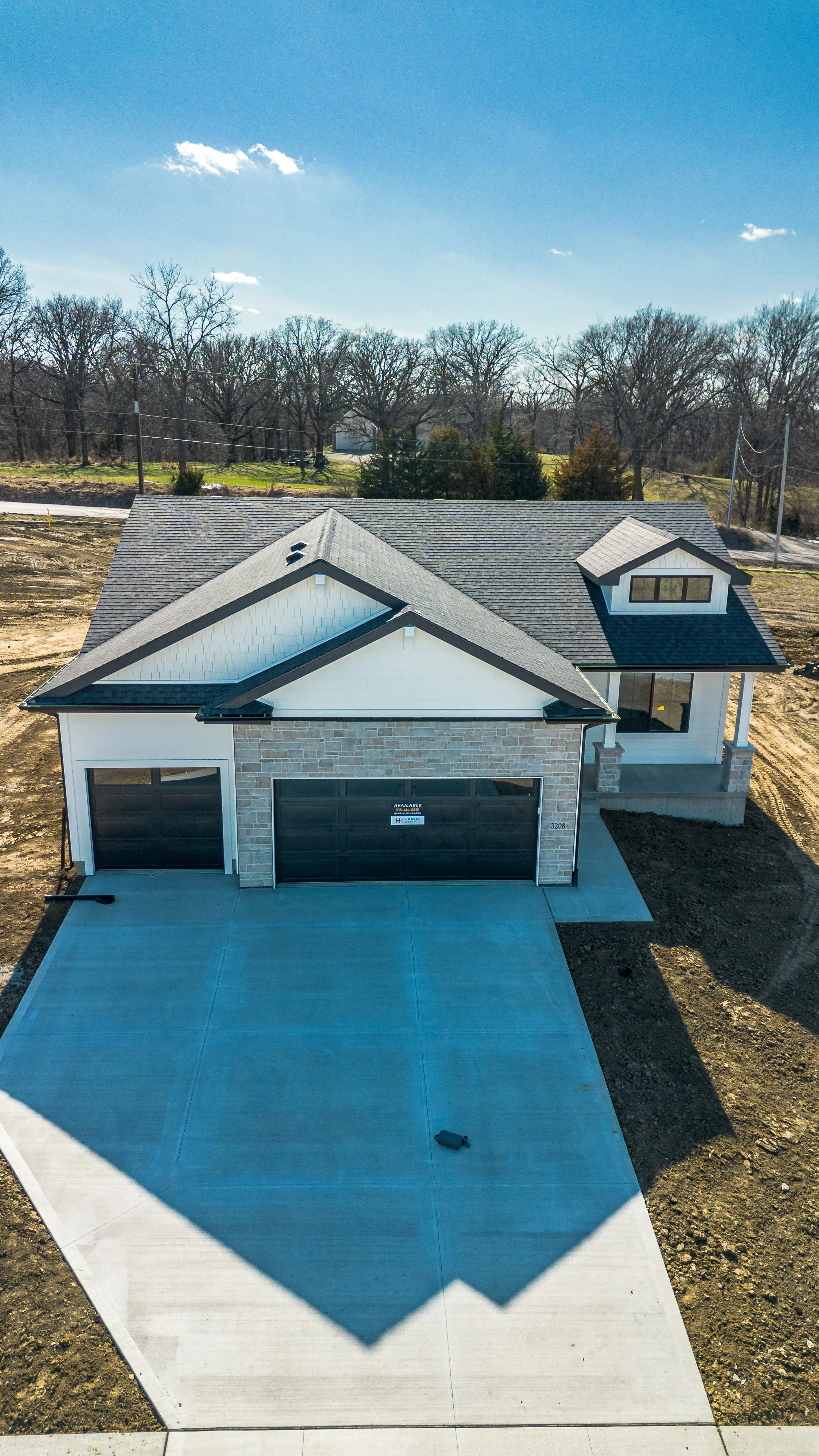 Vertical exterior front view of Hubbell home in Ankeny, Iowa - McDermott Media