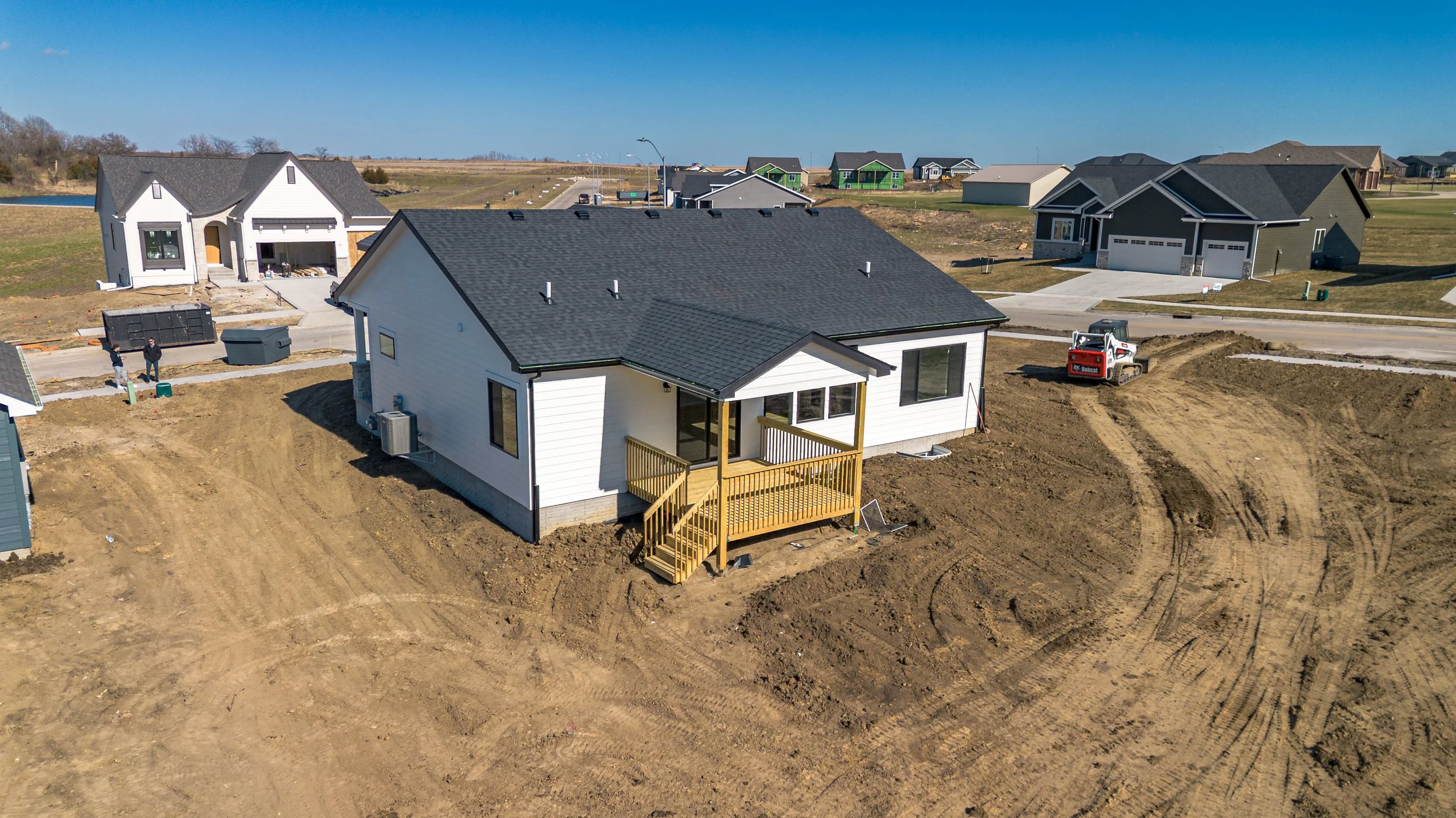 Exterior rear side view of suburban home in Ankeny, Iowa - McDermott Media
