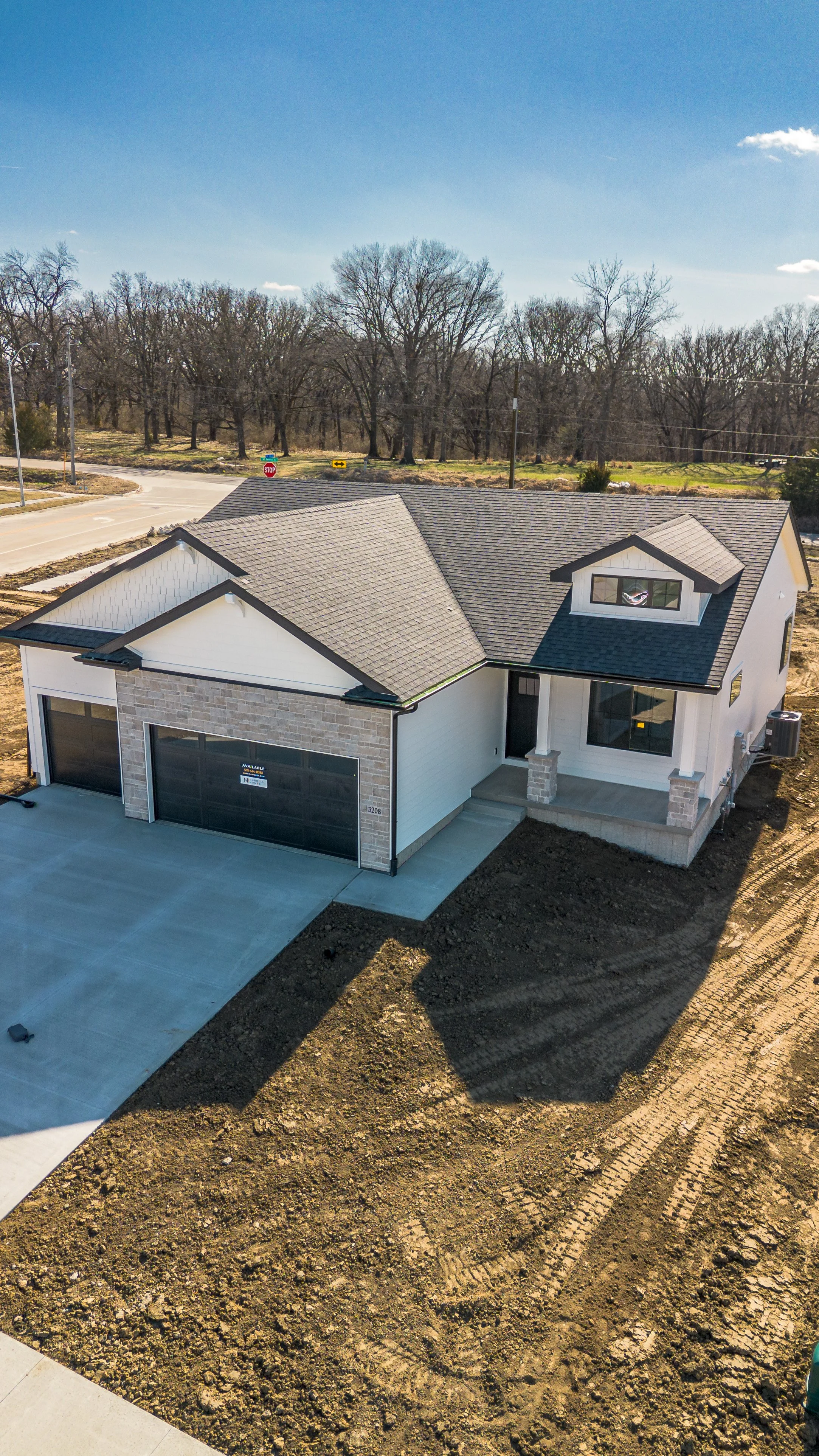 Vertical exterior front view of Hubbell home in Ankeny, Iowa - McDermott Media