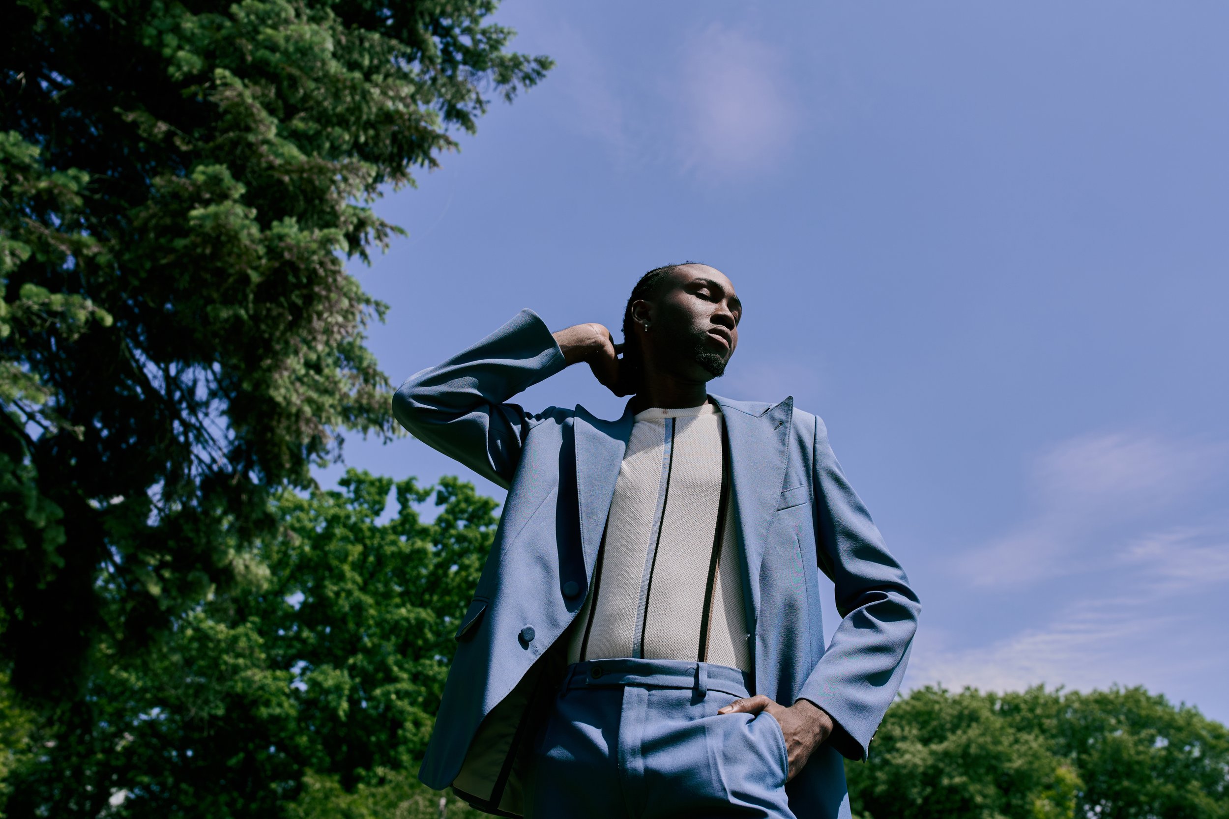 man-in-blue-suit-poses-in-sunny-park-2026-03-12-22-38-55-utc.jpg