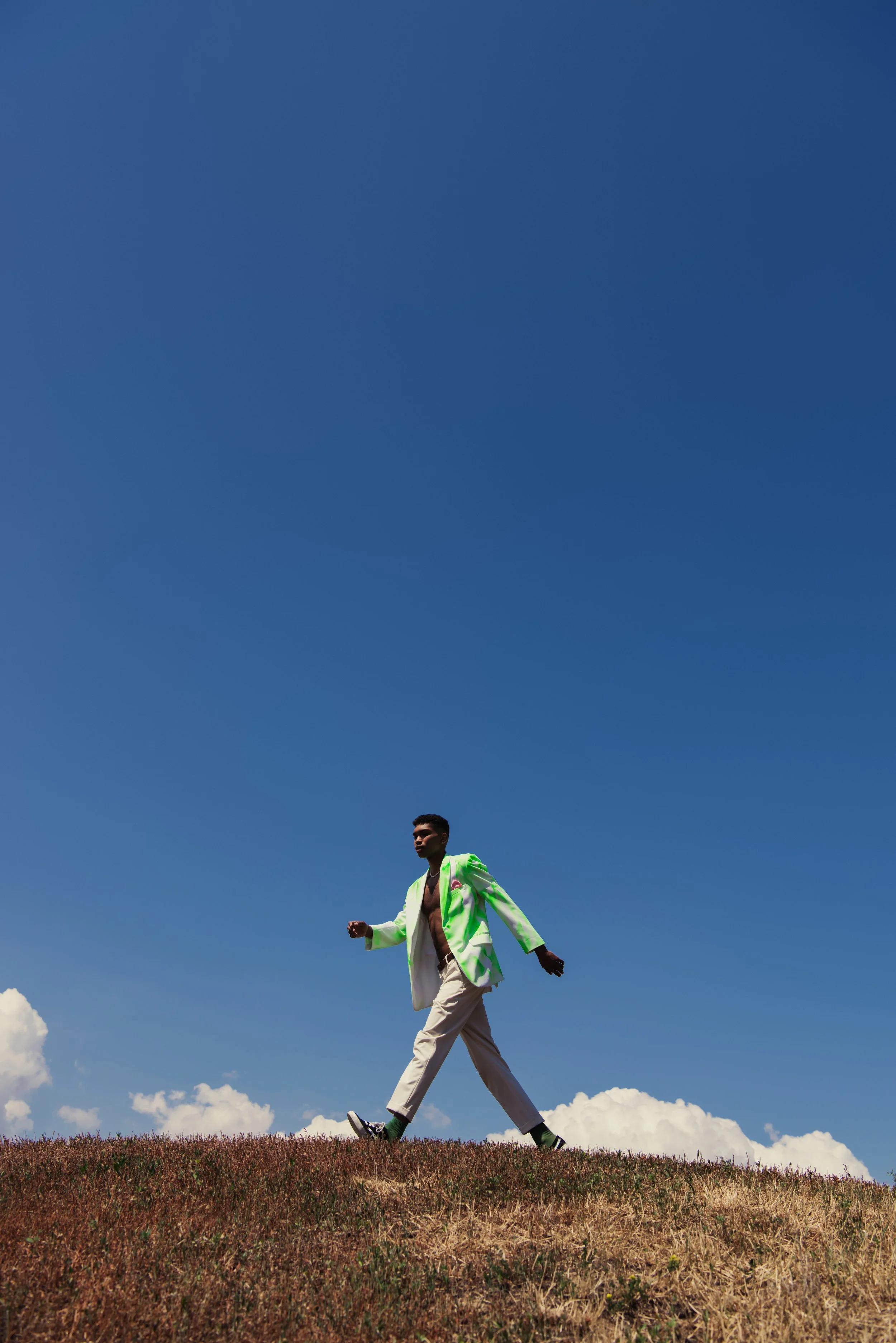 side-view-of-african-american-man-in-blazer-and-pa-2026-03-25-10-21-50-utc.jpg