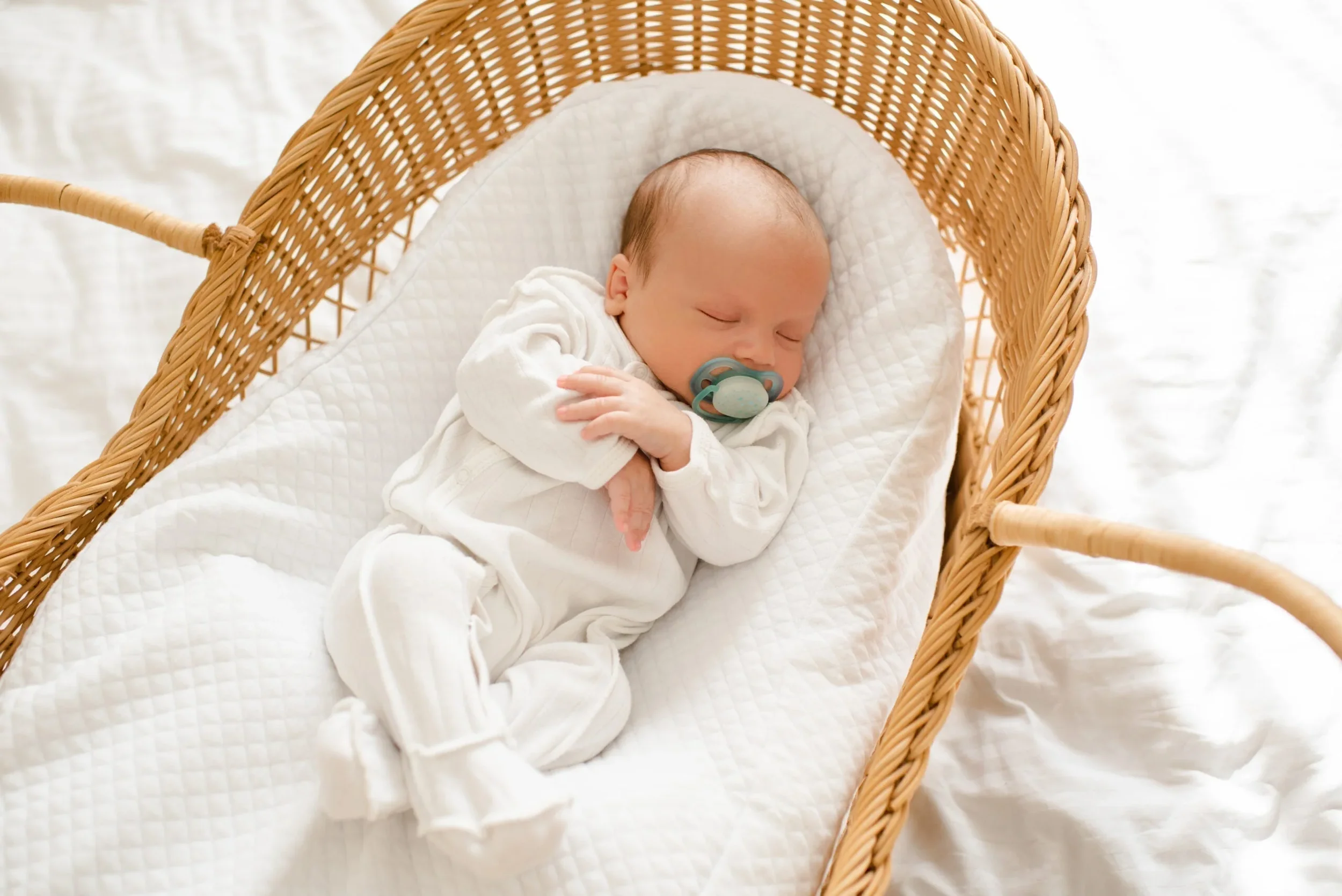 infant-baby-sleeping-in-crib-at-home-top-view-2023-11-27-05-32-01-utc-scaled_6e2a8561-a57d-42b7-95b7-6c0a967ed34c.webp