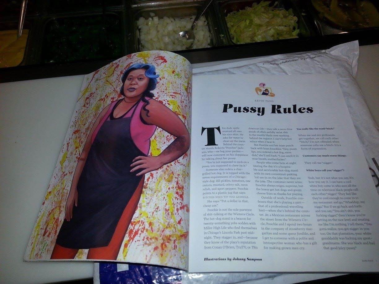 Open magazine pages on a table, showing a colorful illustration of a woman with multicolored hair and a black apron on the left page, and a story titled 'Pussy Rules' on the right page.