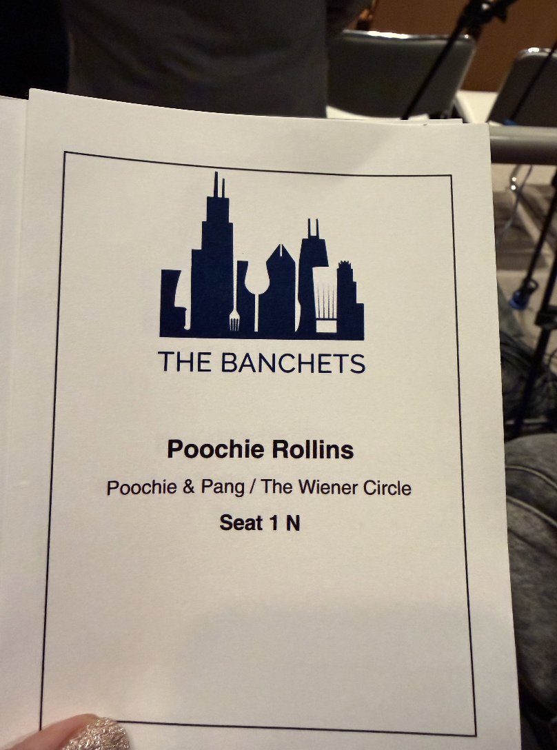 The image shows a conference or event program with the title "THE BANCHETS." The program lists a session called "Poochie Rollins" with the subtitle "Poochie & Pang / The Wiener Circle," and mentions seat 1 N. The program has a graphic at the top depi