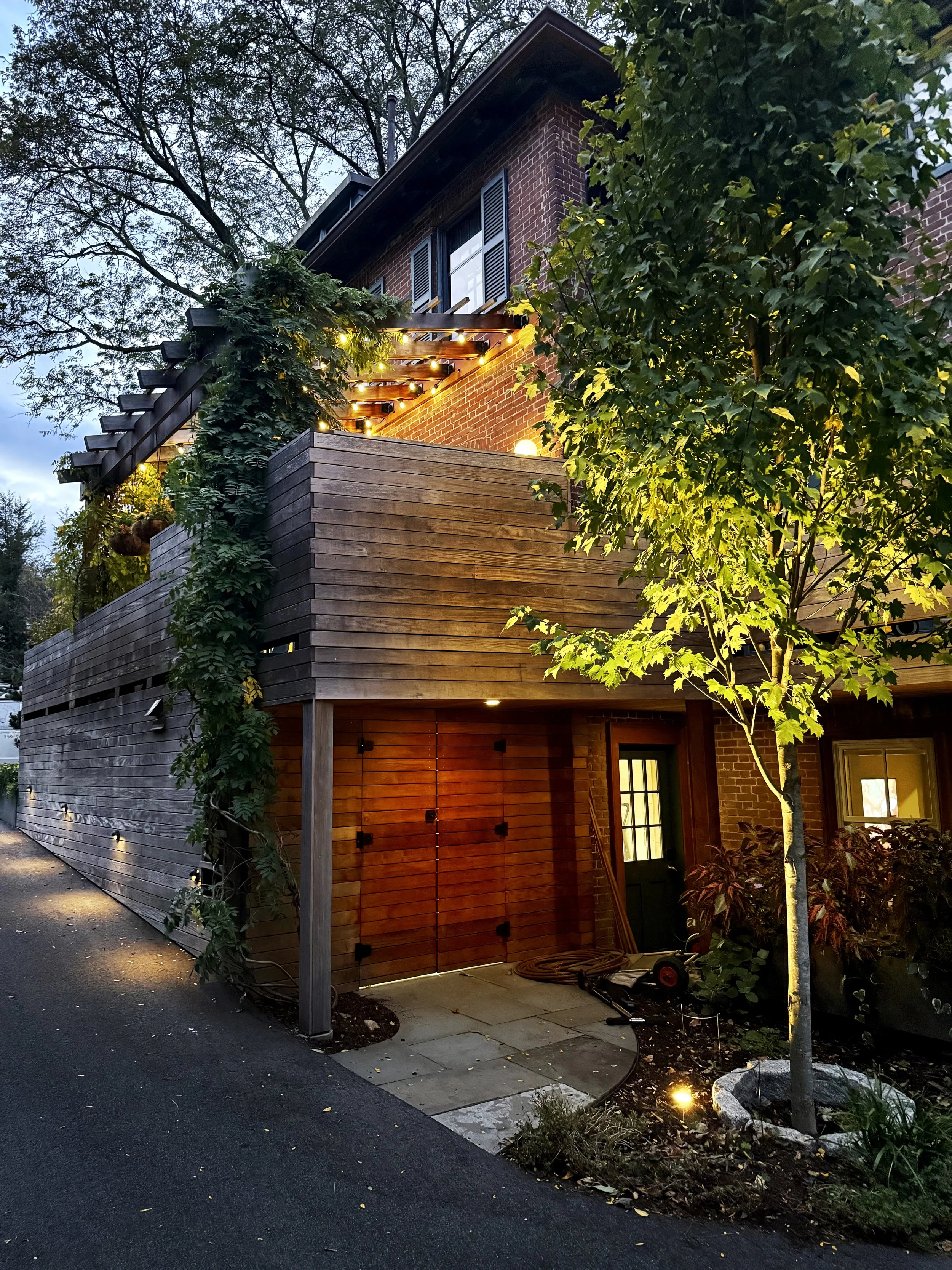 Exterior landscape lighting installation in South Shore home in Norwell MA by licensed electrician.