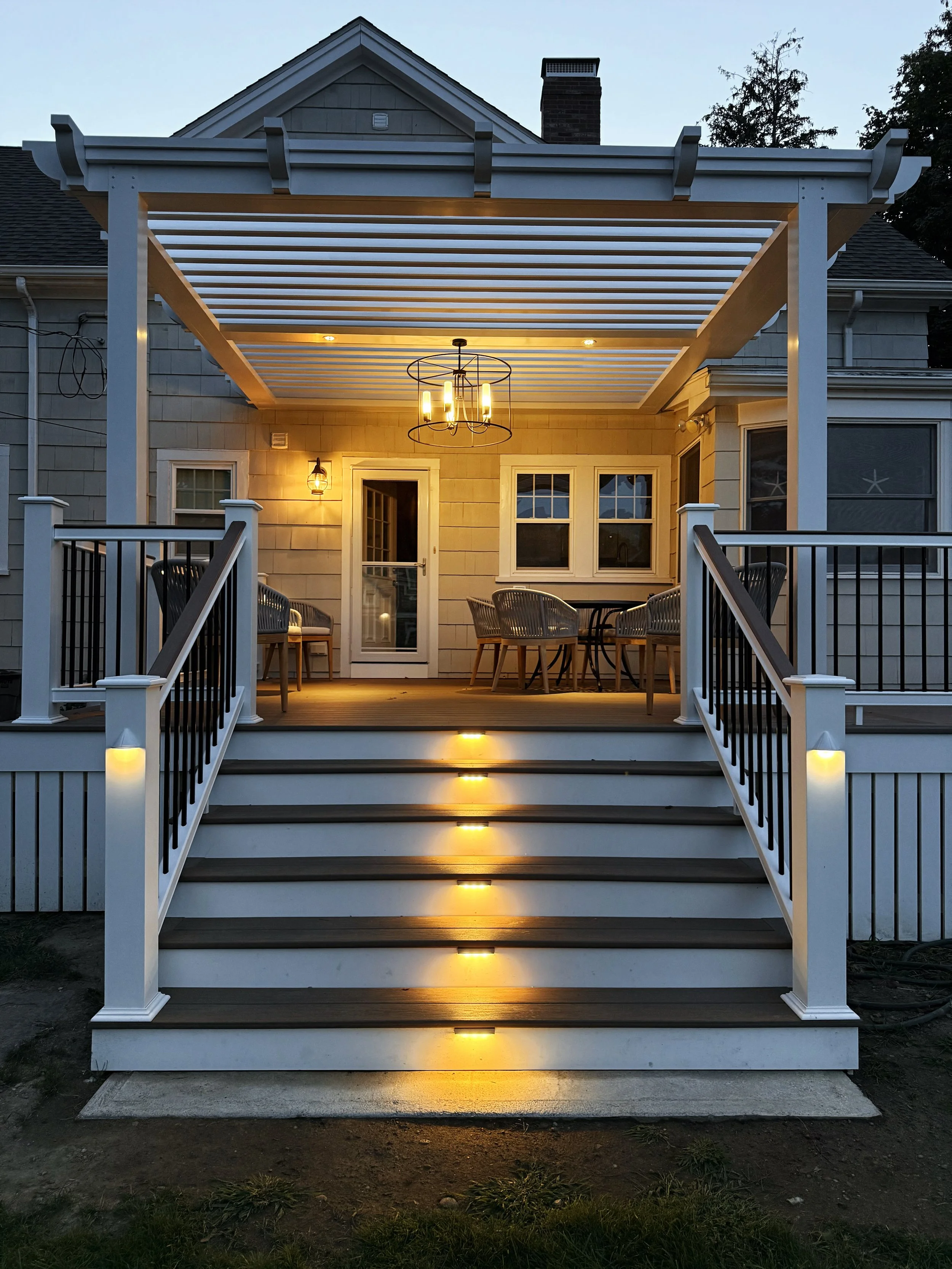 Exterior landscape lighting installation in South Shore home in Duxbury MA by licensed electrician.