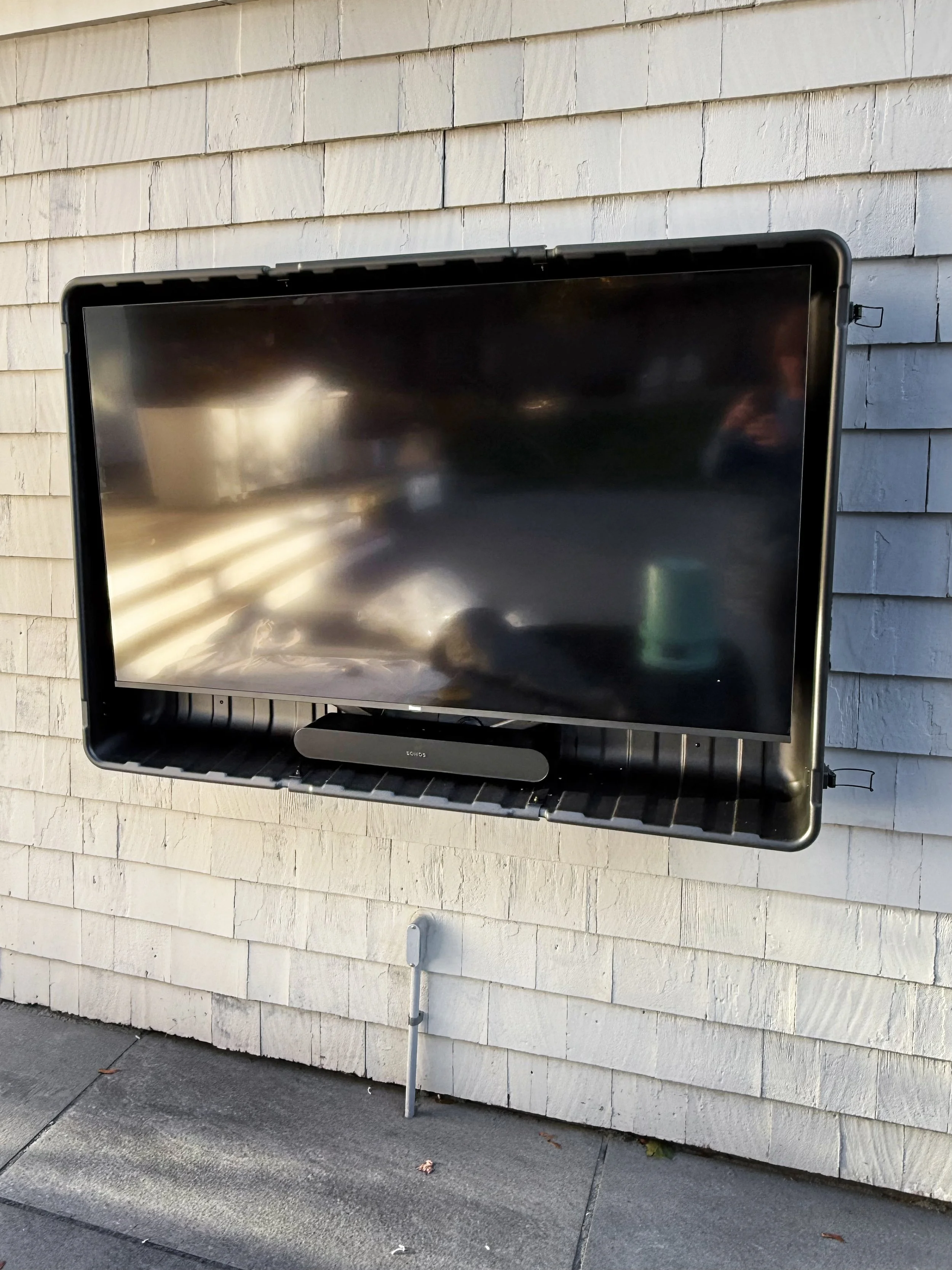 Wall mounted TV installation in South Shore home in Hingham MA by licensed electrician.