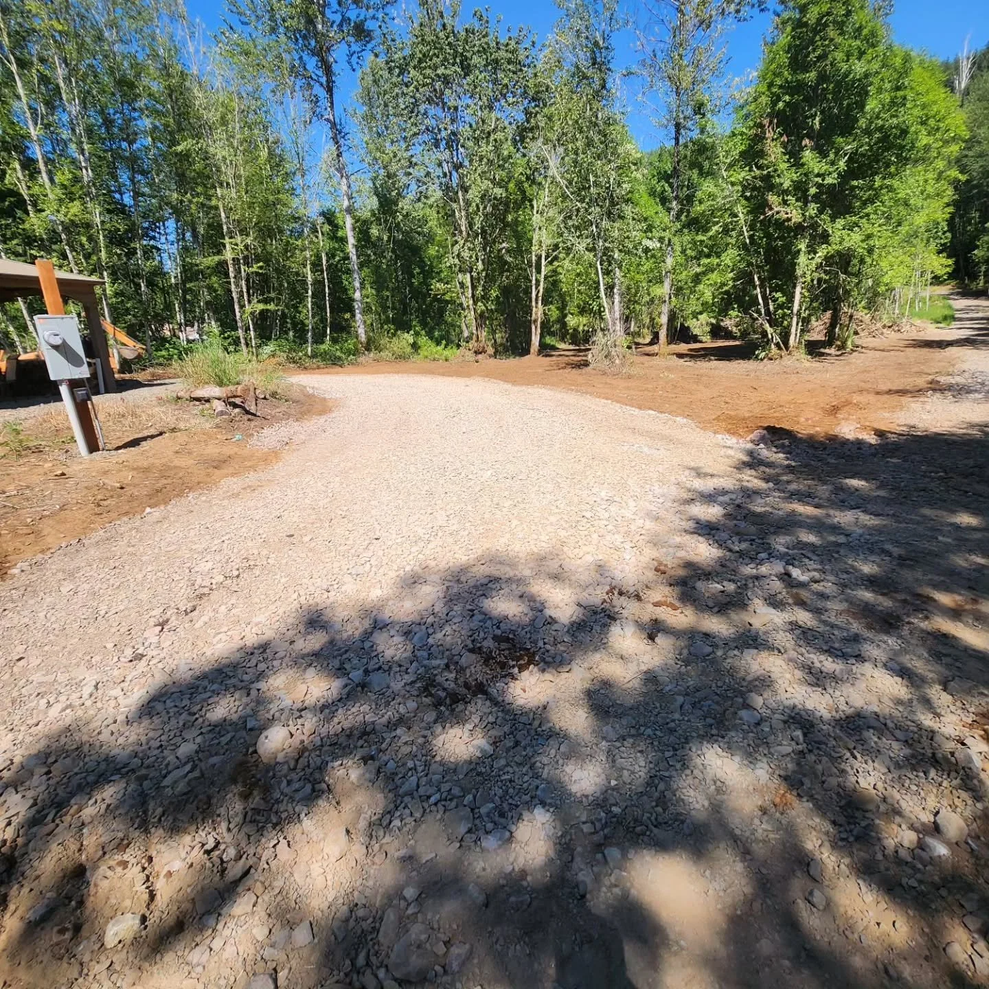 100 ft of new road to improve access and about 1 acer cleared off this property so the owner can plant some grass.