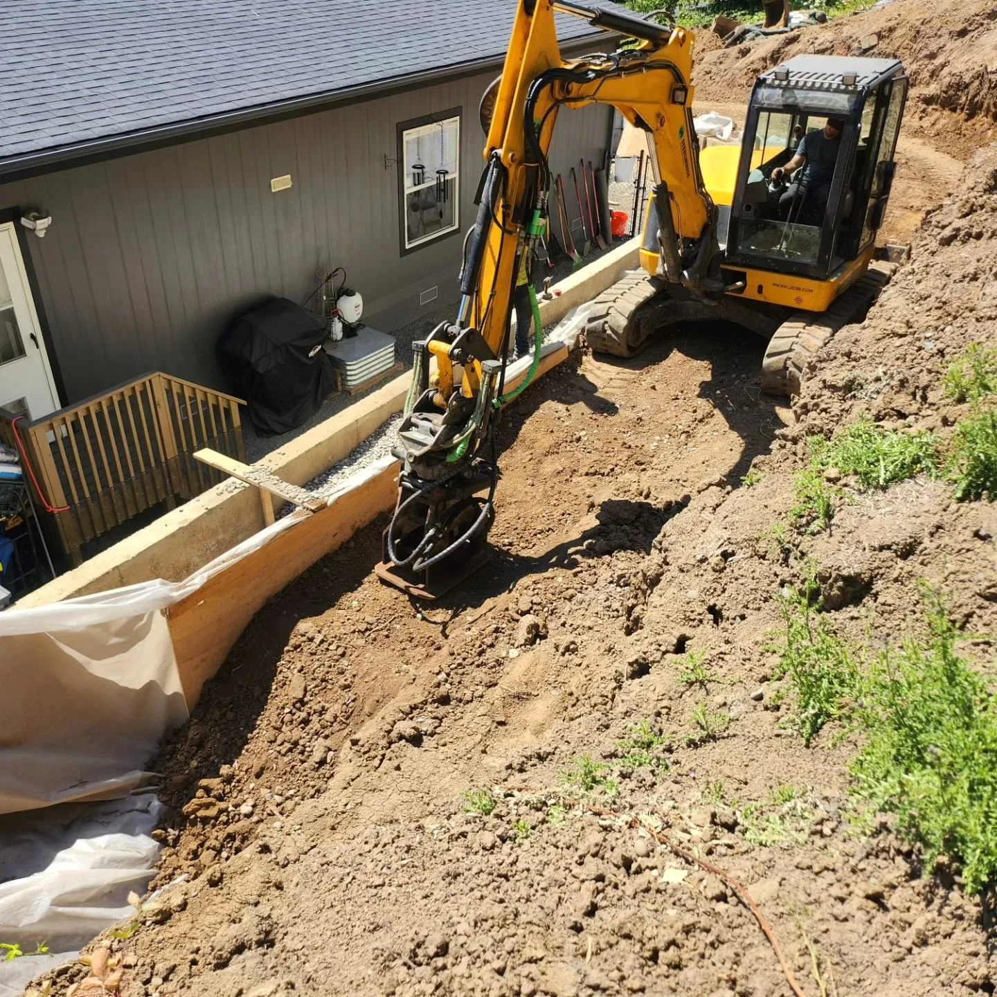 retaining wall backfill, hoepack, compaction, steelwrist