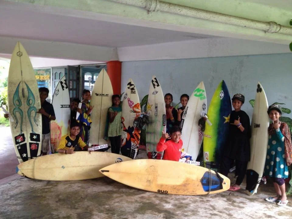 The kids in the Bangladesh Surf Club with the surfboards sent over by Angie and her non-profit the Pelican Crew.
