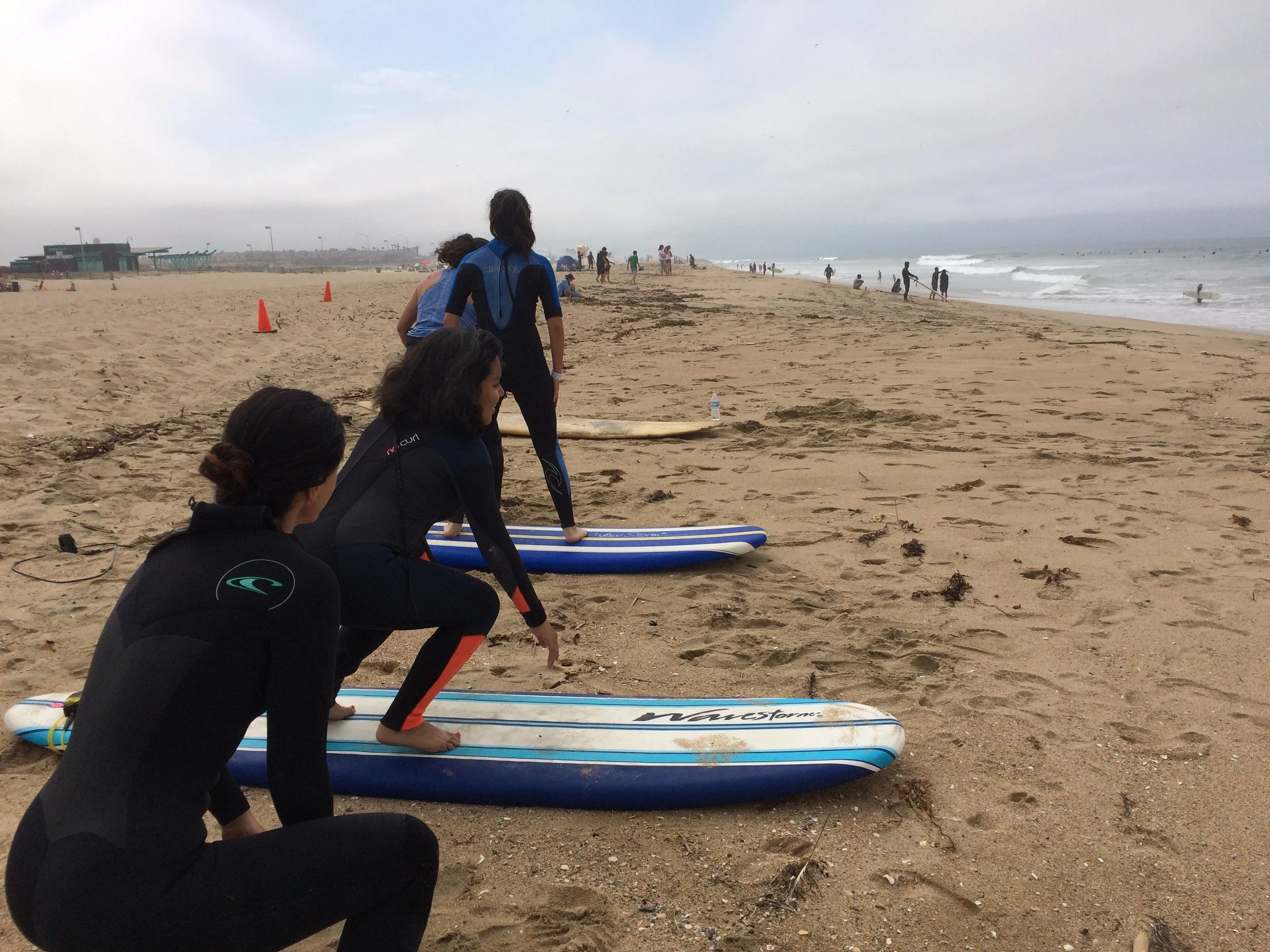 Angie giving surf lessons to the kids in Operation Progress.  Surfing builds confidence and mental strength.