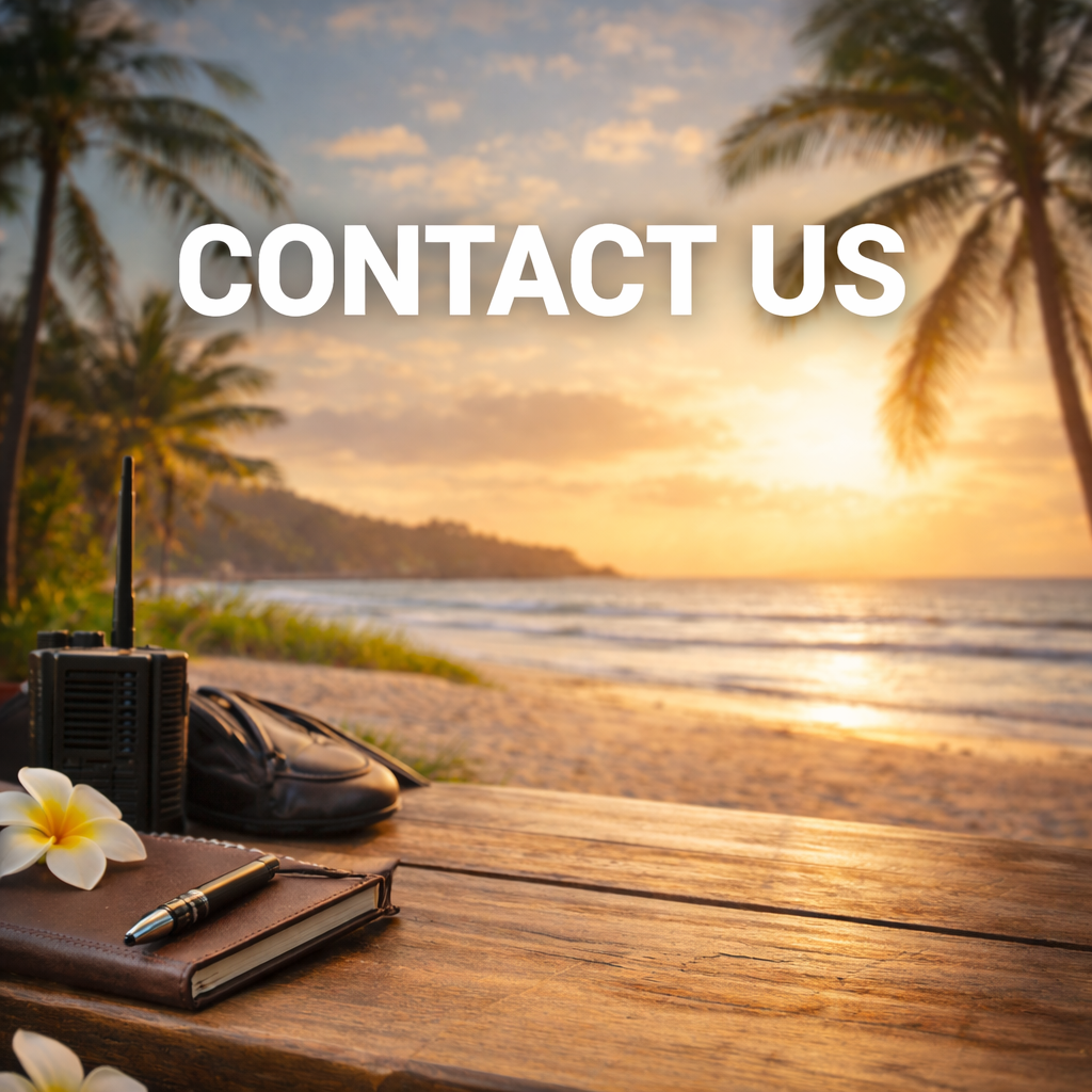 Beach scene at sunset with palm trees, a wooden table with a notebook, pen, wallet, radio, and flower, and the text 'Contact Us' overlayed.