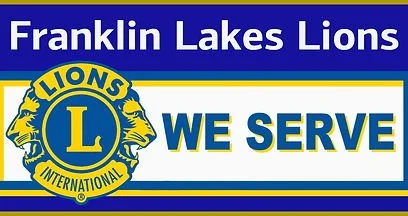 Franklin Lakes Lions banner with Lions International logo and the slogan 'We Serve'.
