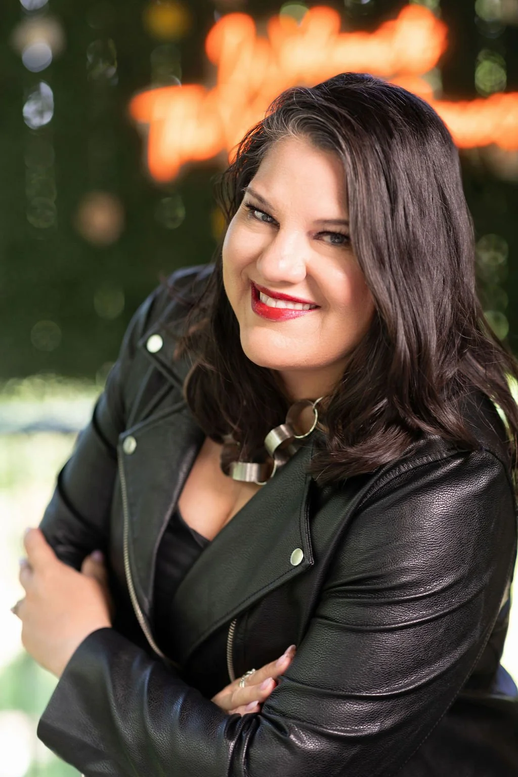 Shannon Villalba in a black jacket smiling at the camera