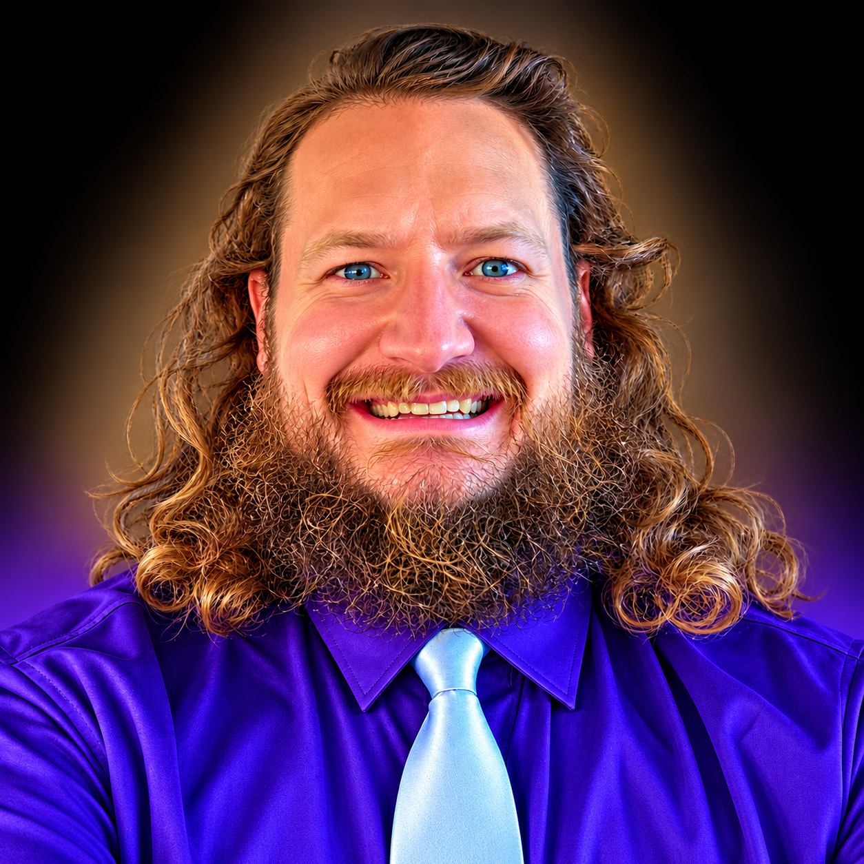 Smiling Bearded Man in Purple Tie.png