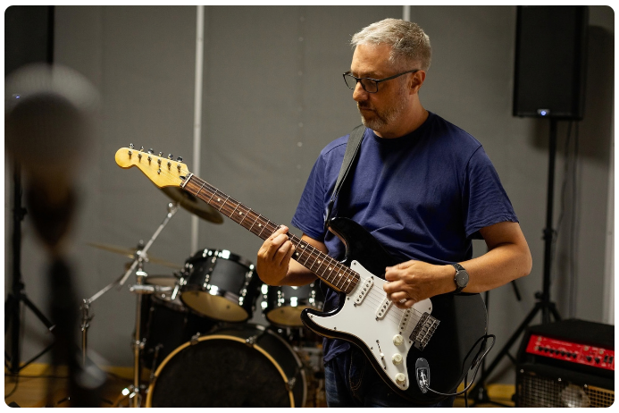 man playing guitar.png