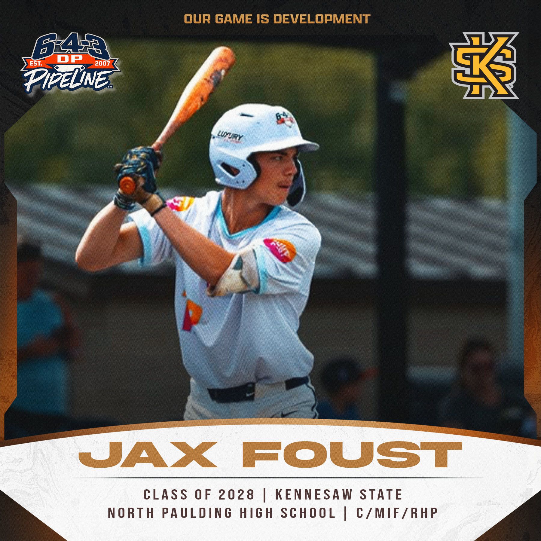 A young male baseball player wearing a white helmet and uniform with colorful patches, holding a bat in a swing stance during a game or practice.