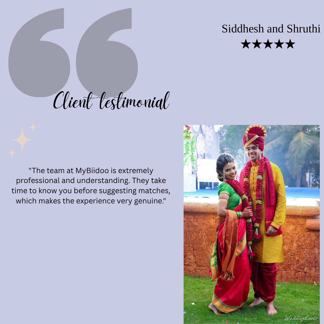 A wedding couple dressed in traditional Indian attire, standing outdoors with a pool and greenery in the background, celebrating their marriage.