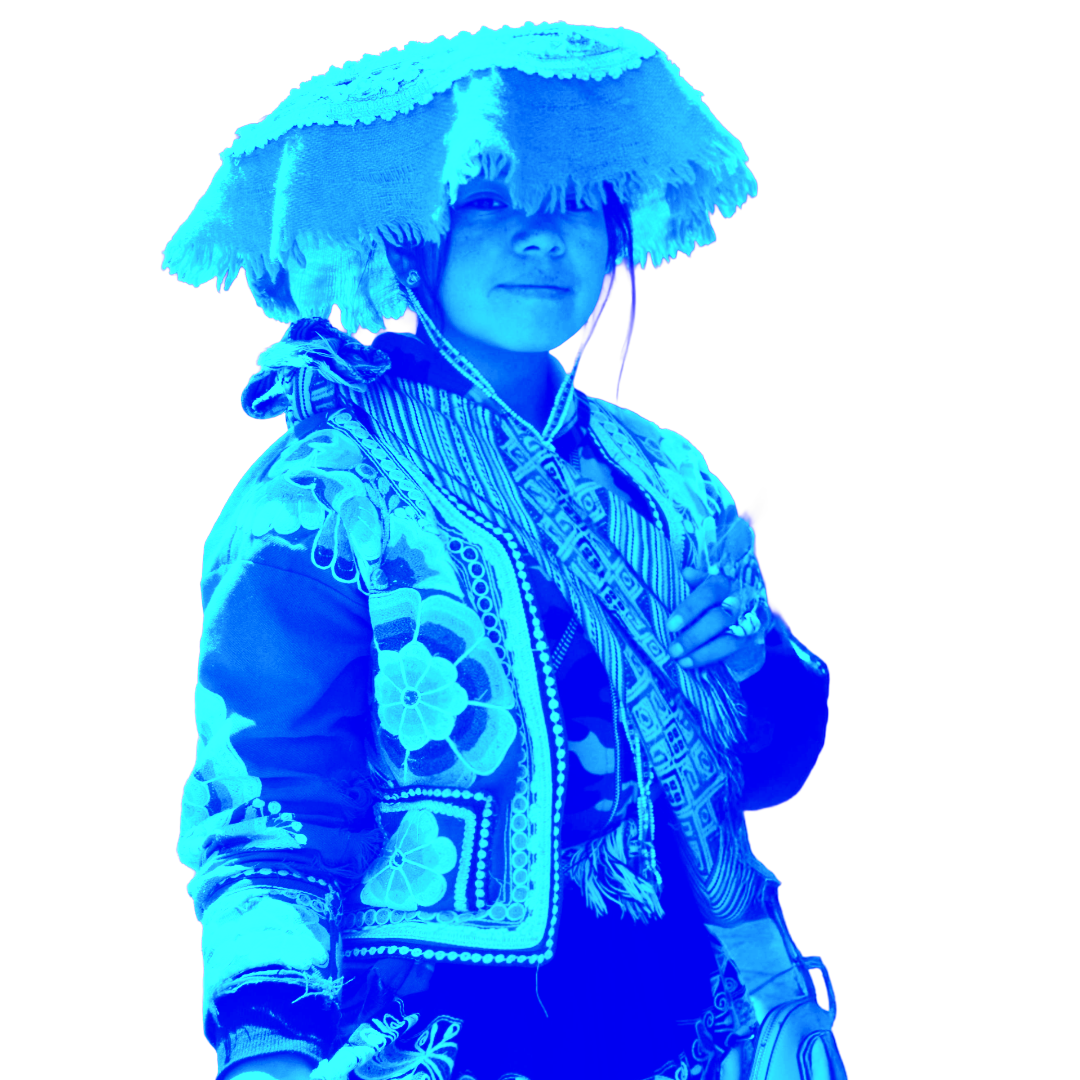 A person wearing traditional Peruvian attire, including a large woven hat and an embroidered jacket, standing against a white background.